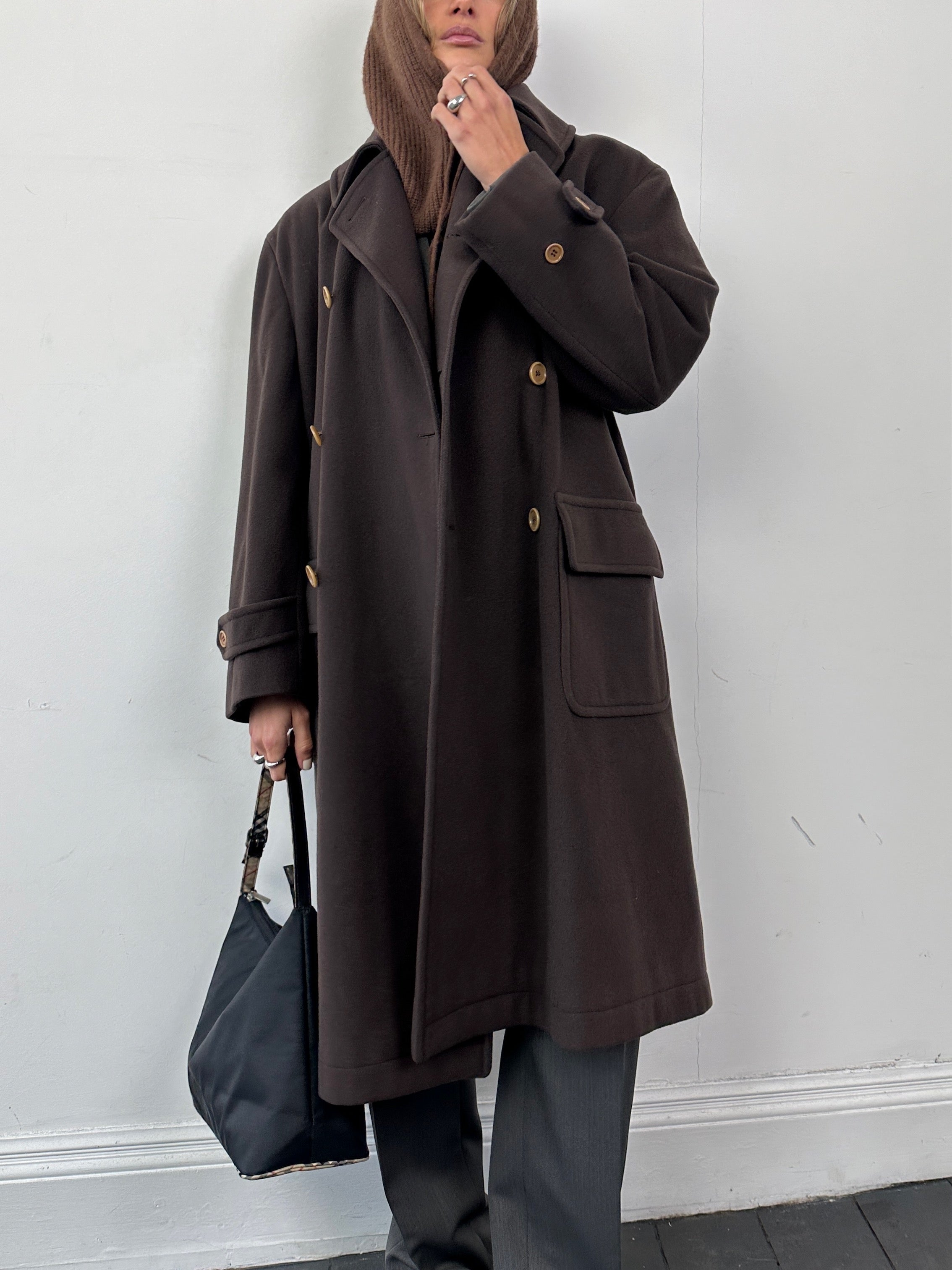 Valentino pure wool double-breasted coat in XL, featuring classic lapels and a tailored fit, displayed on a hanger.