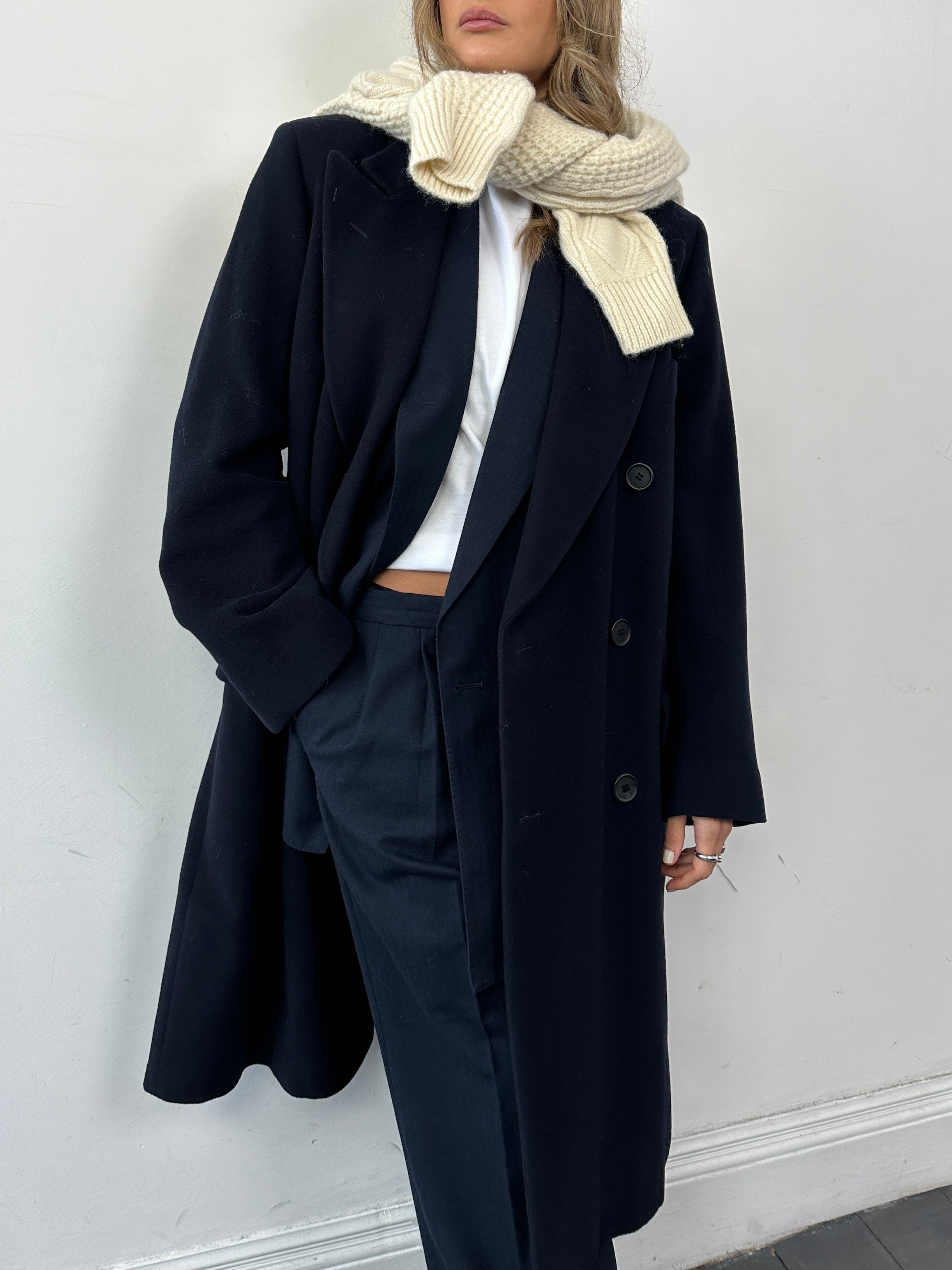 Giorgio Armani pure wool double-breasted coat in size L, tailored fit with classic lapels and sleek design, displayed on a hanger.