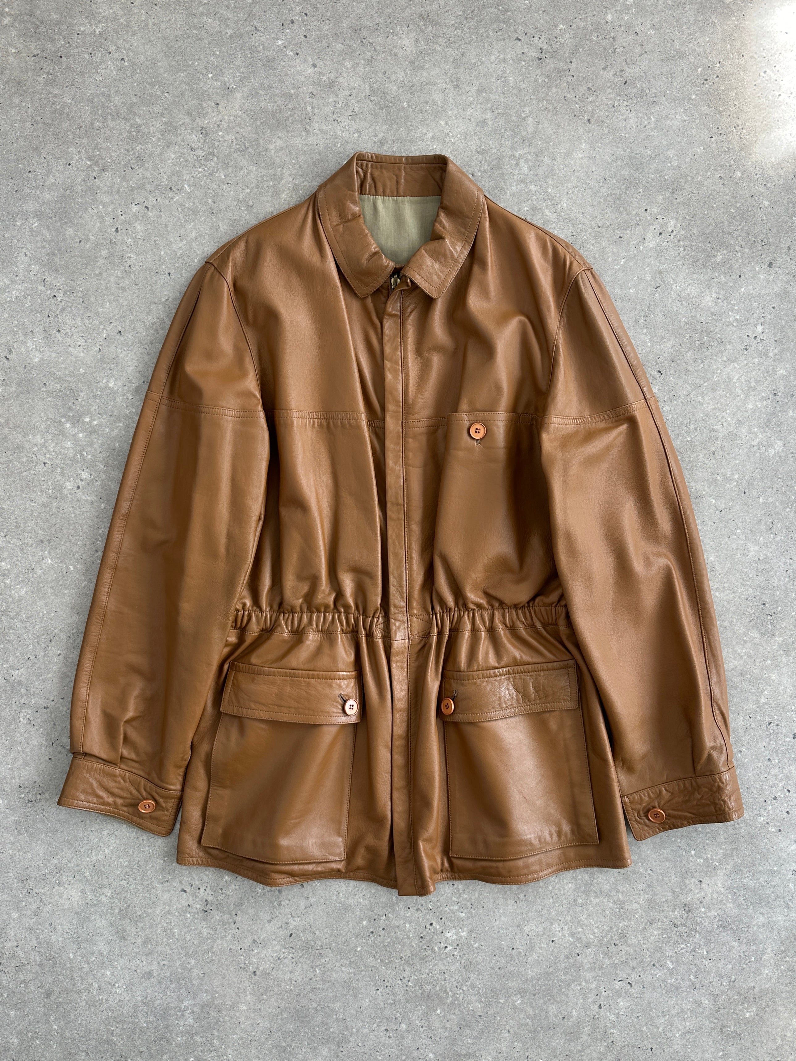 Vintage 1980s Italian reversible leather jacket with cinched waist, XL size, featuring classic retro style and high-quality craftsmanship.