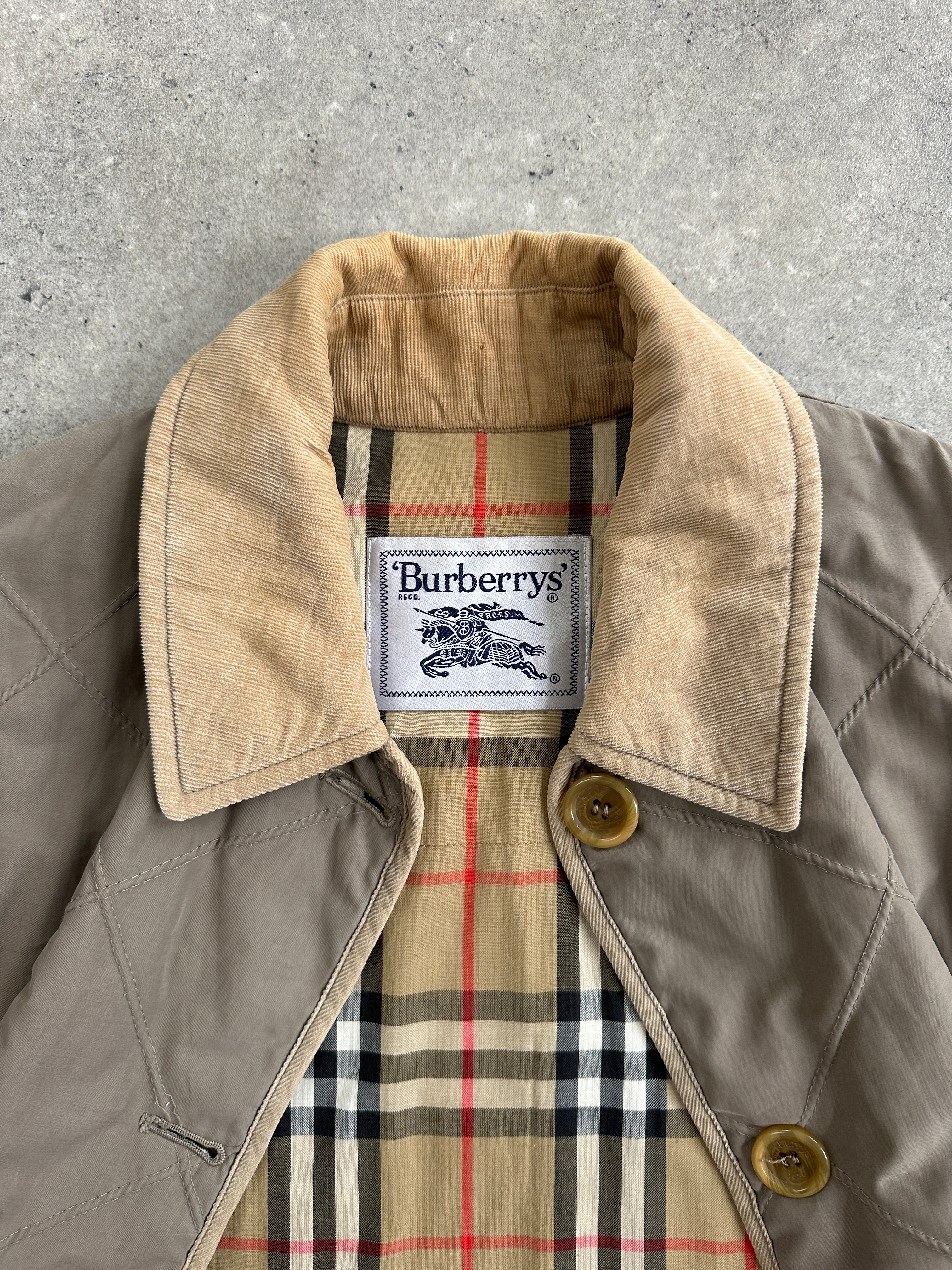 Burberry 1990s quilted Nova Check cord collar coat, casual style, front view showing quilted fabric and signature check pattern.