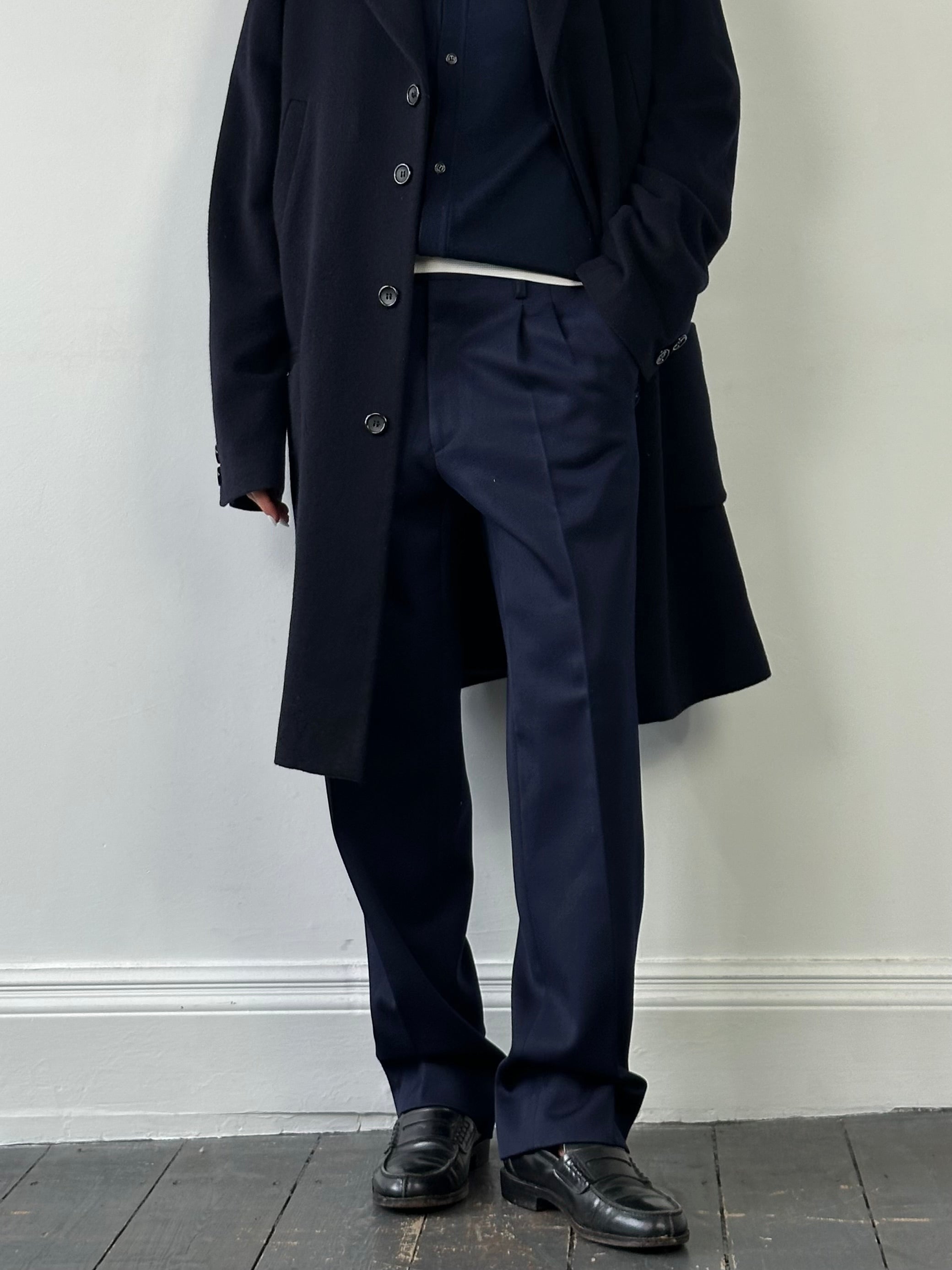 Vintage Italian vintage pure wool tailored trousers in size W32, showcasing classic fit and fine wool fabric.