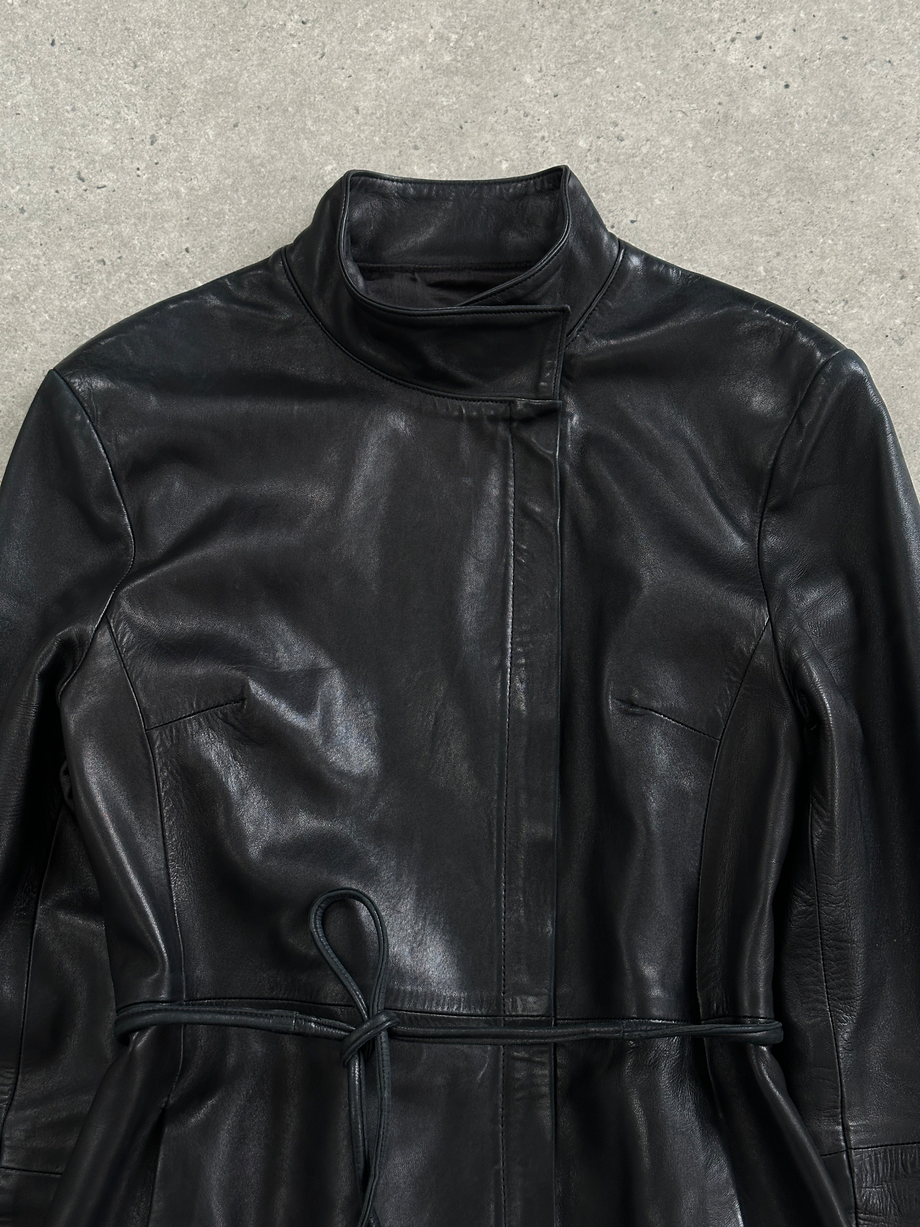 Vintage French 1990s high neck leather jacket with tie belt, in size S/M, featuring classic design and textured leather details.