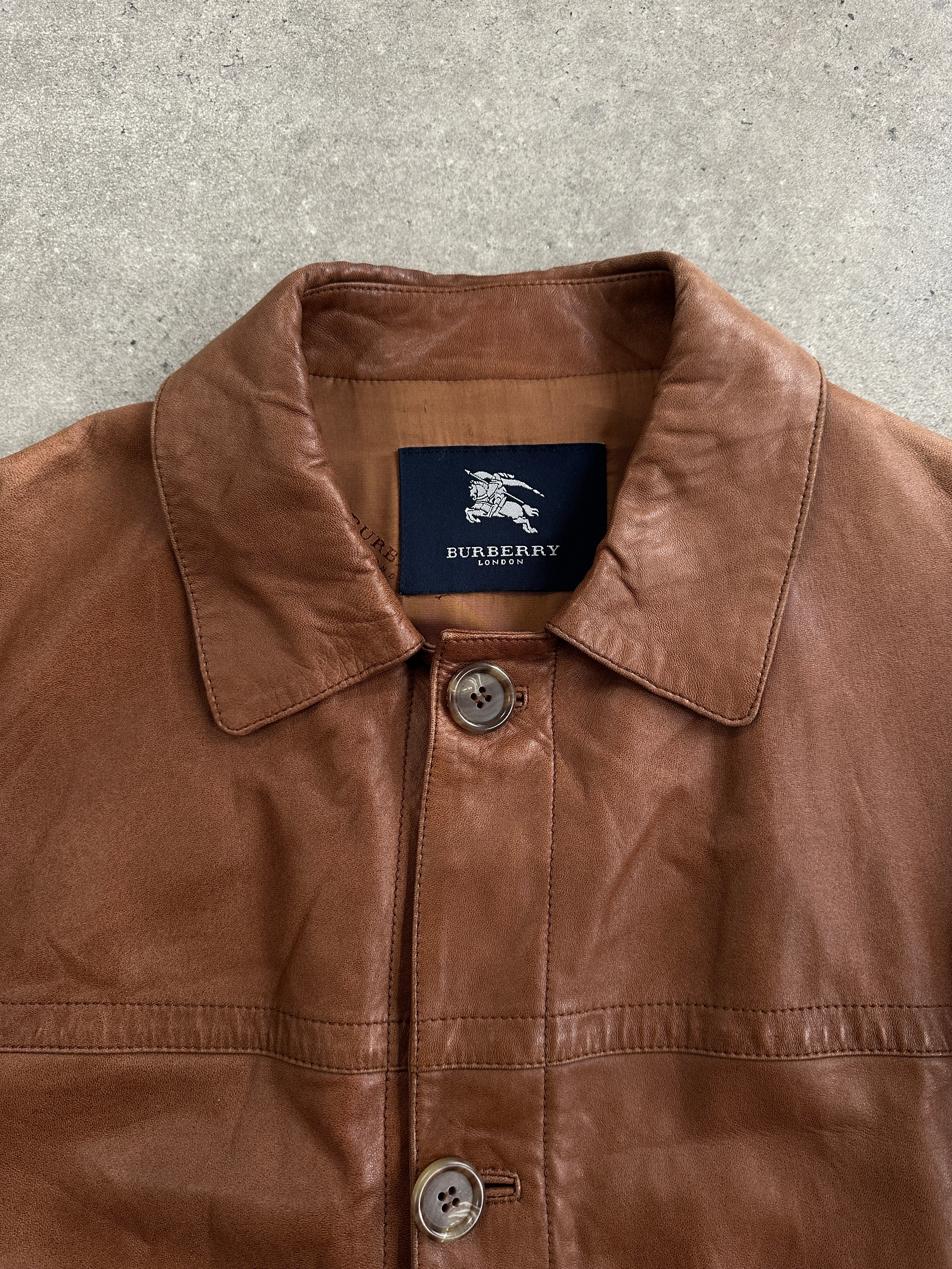 Burberry London 2000s aged smooth leather jacket in XL, showcasing classic design with aged brown leather and tailored fit.