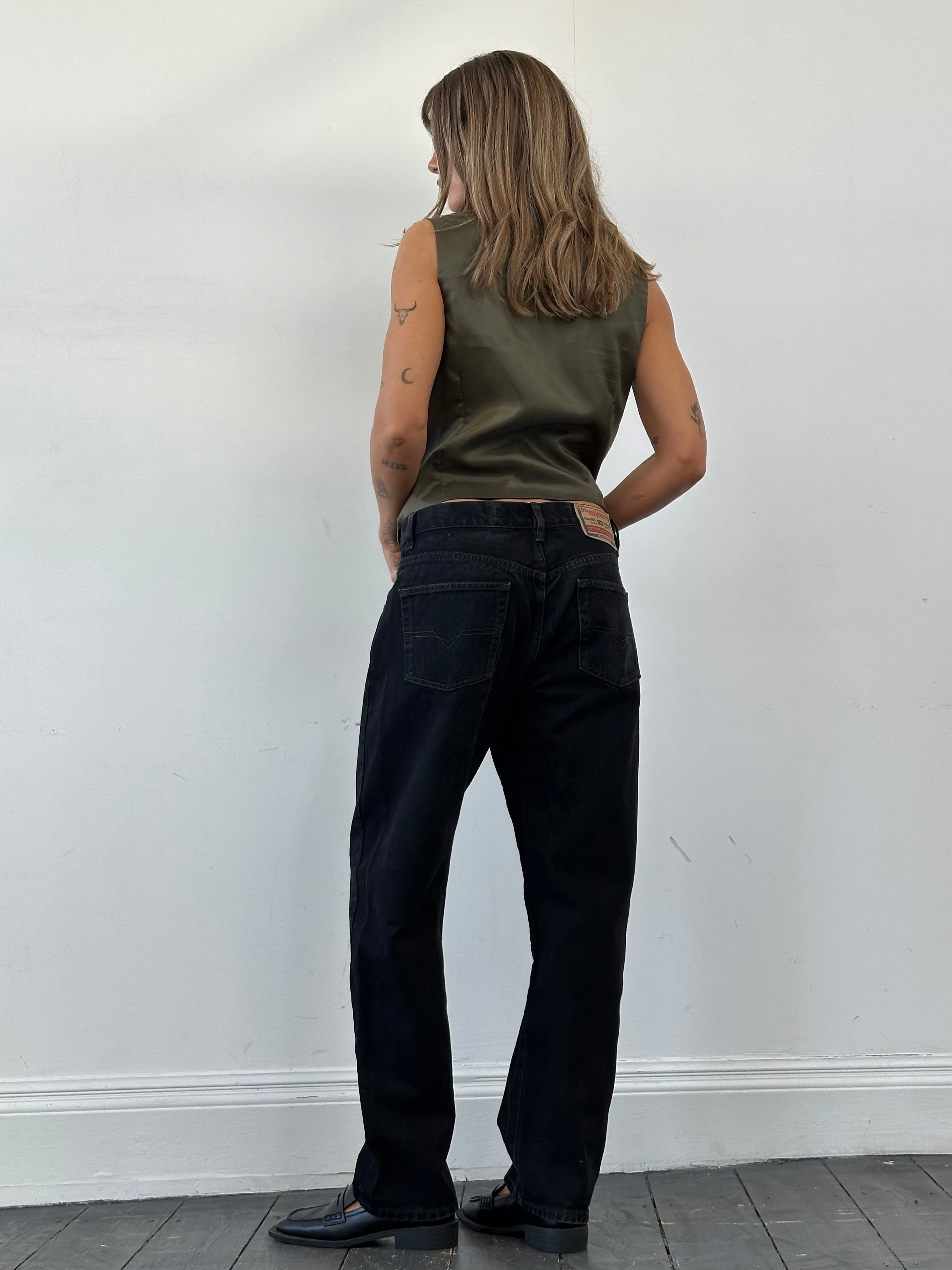 Diesel high waisted straight leg denim jeans, size W32, showing front view with classic blue denim and minimal fading.