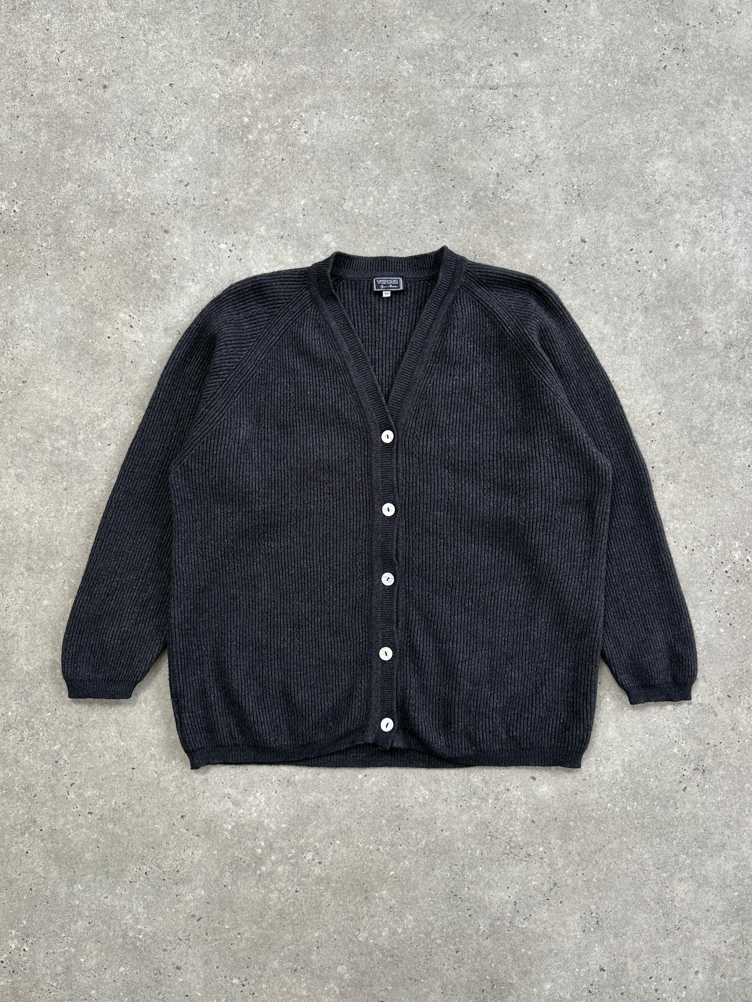 Versace Versus 1990s wool cardigan in size M/L, featuring classic design and textured knit in neutral colors.