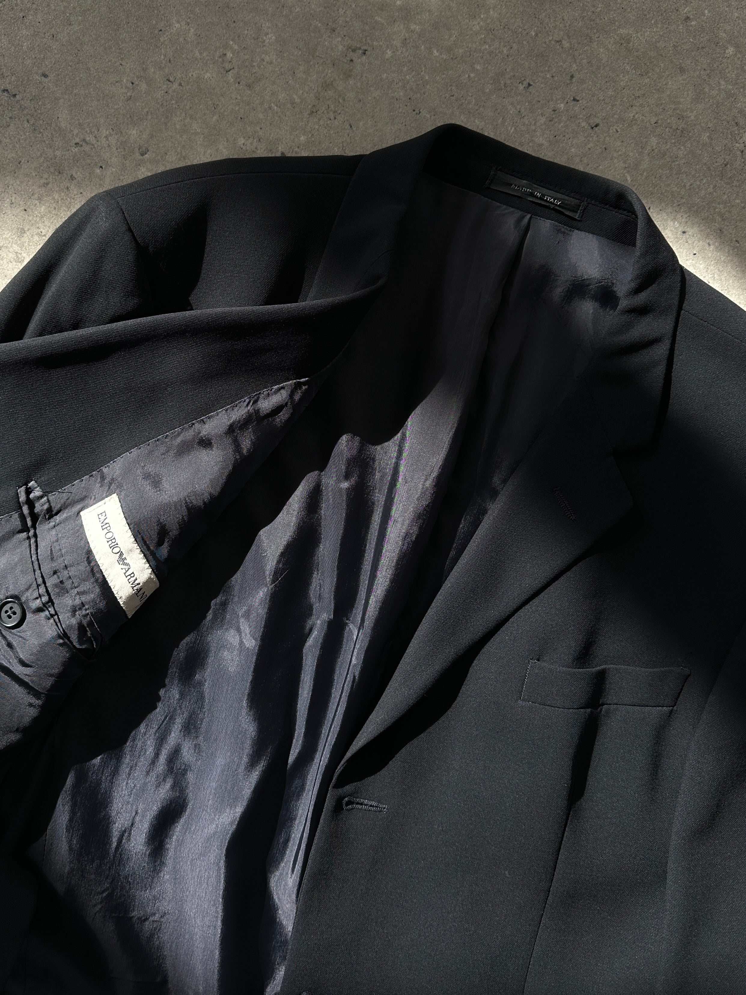 Emporio Armani wool single-breasted blazer in size 44R/XL, tailored fit with classic lapel and button closure, in neutral color.