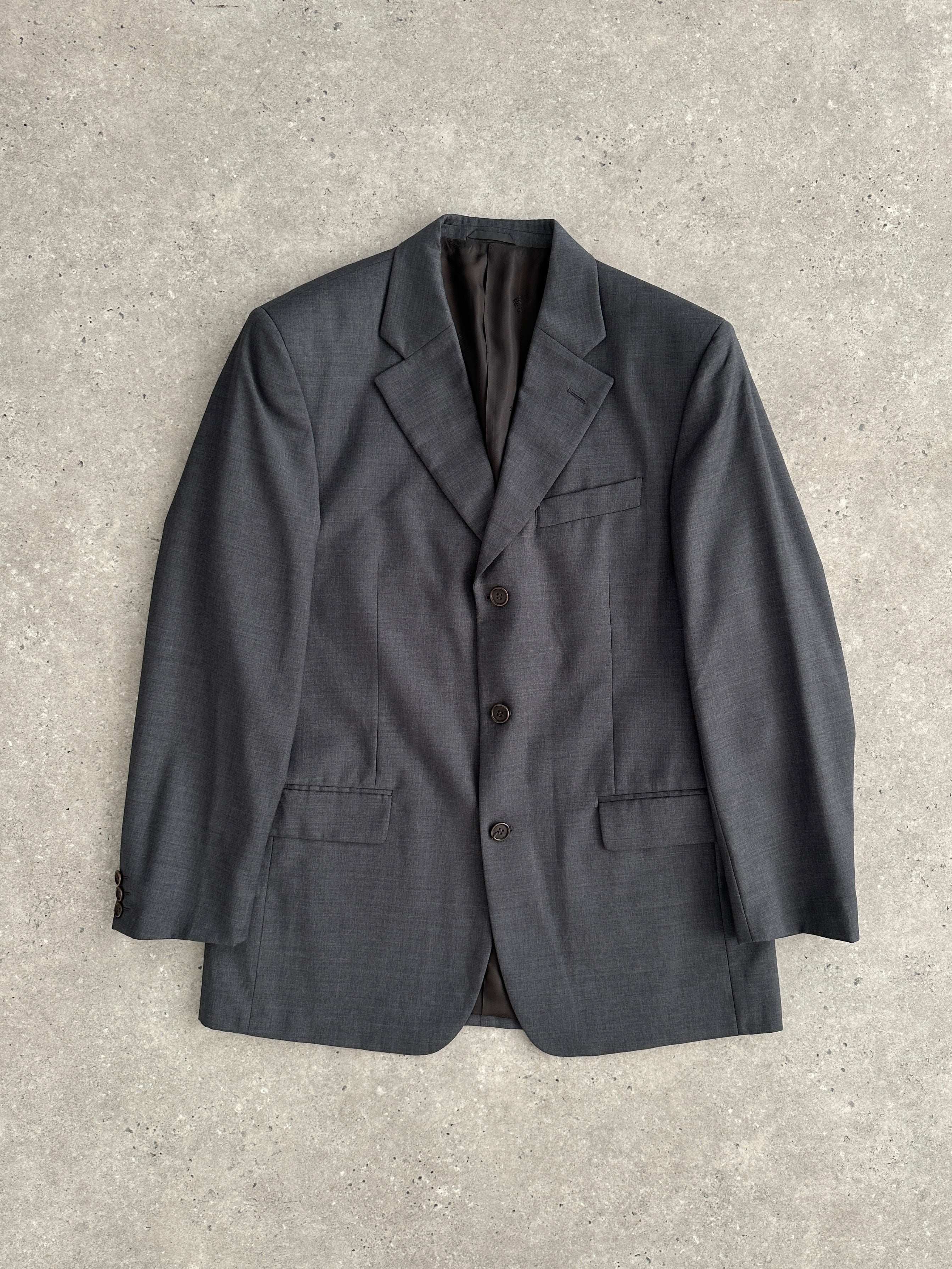 Gianfranco Ferre virgin wool single-breasted blazer in size 40R/L, tailored fit with classic lapel and button closure.