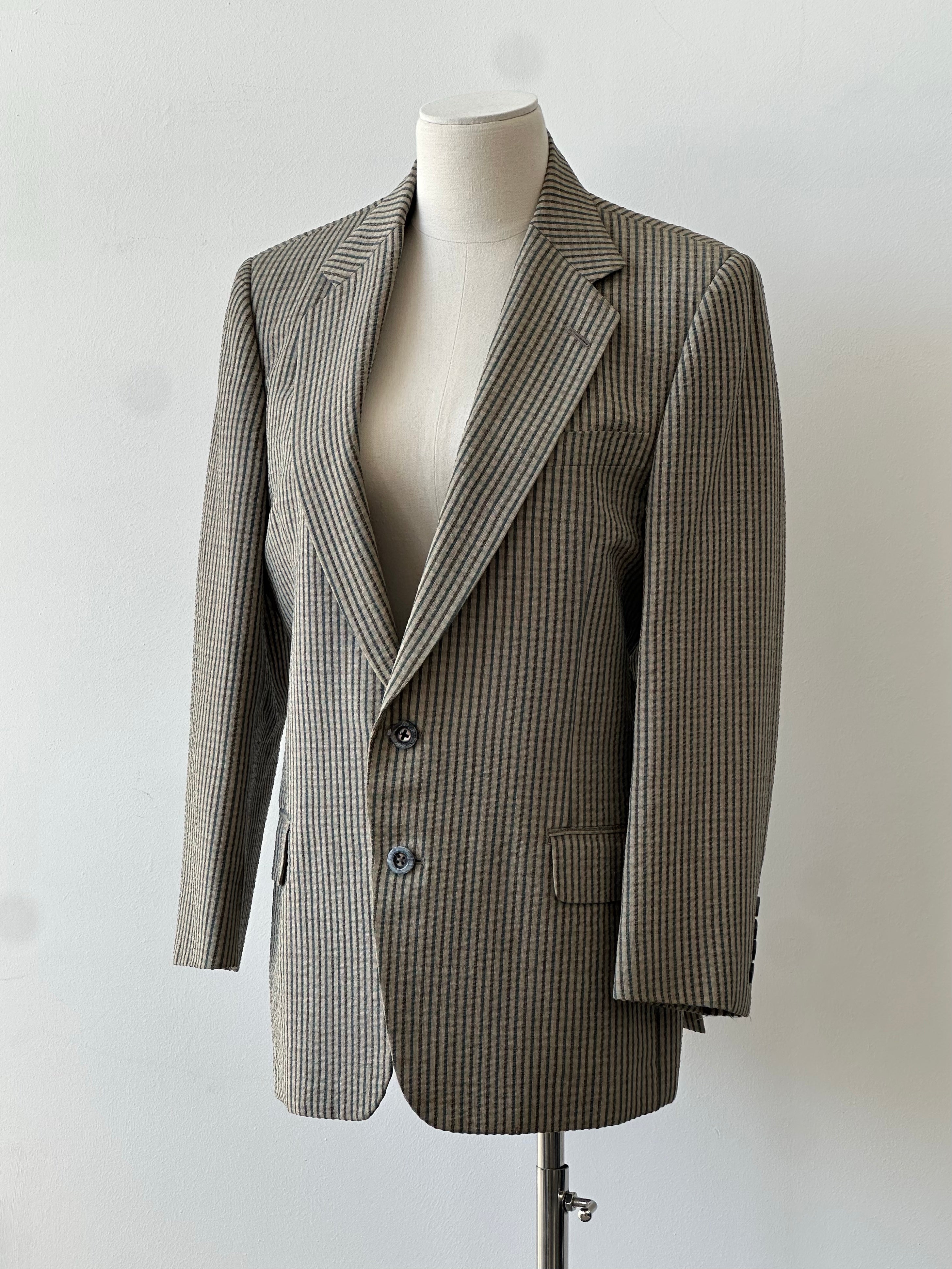 Burberry 1990s wool silk check unlined blazer in size S, featuring classic plaid pattern and tailored fit, displayed on a hanger.