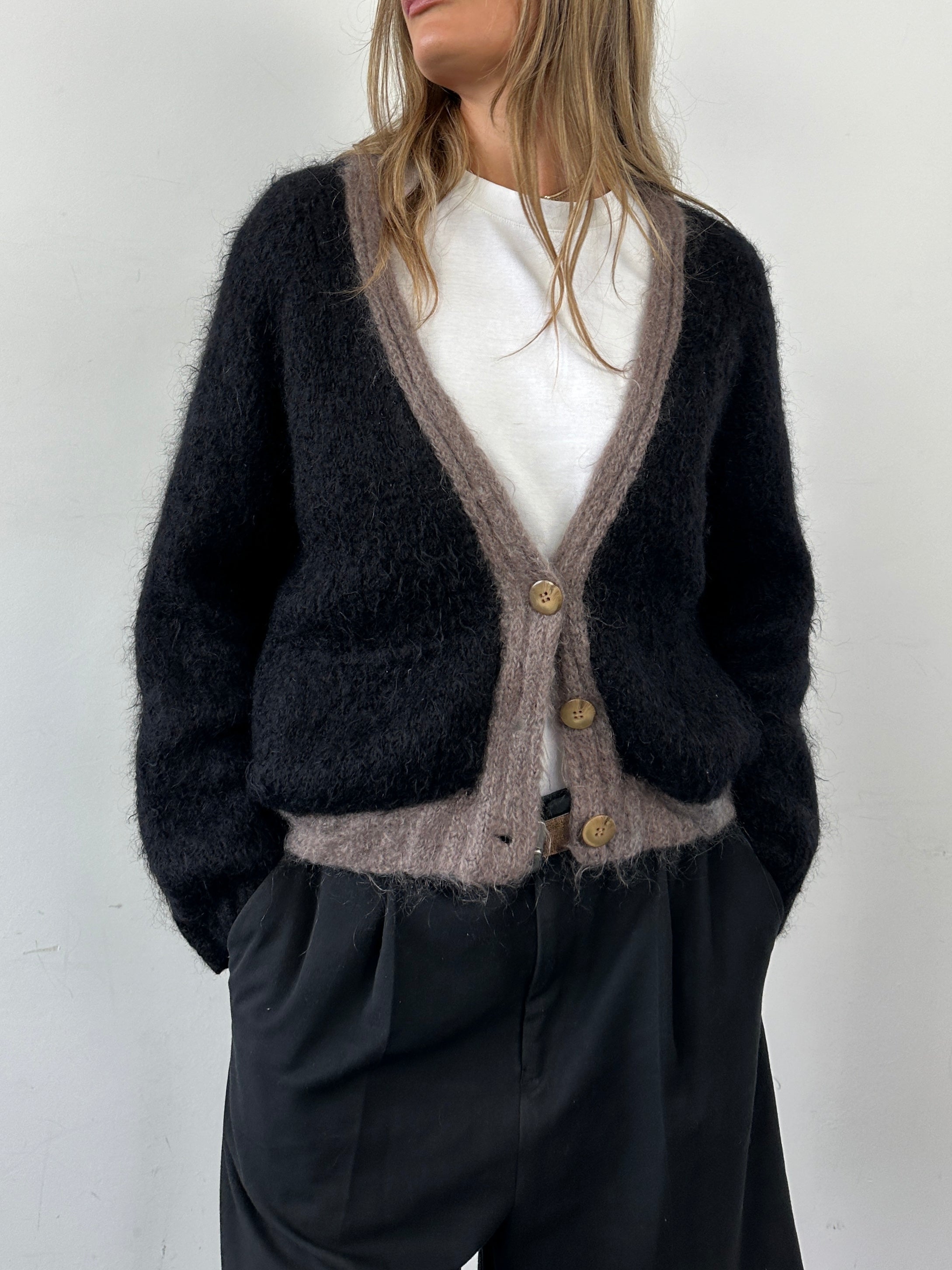 Vintage mohair wool fuzzy cardigan in size L, featuring a cozy, textured knit with a classic design and soft, warm appearance.