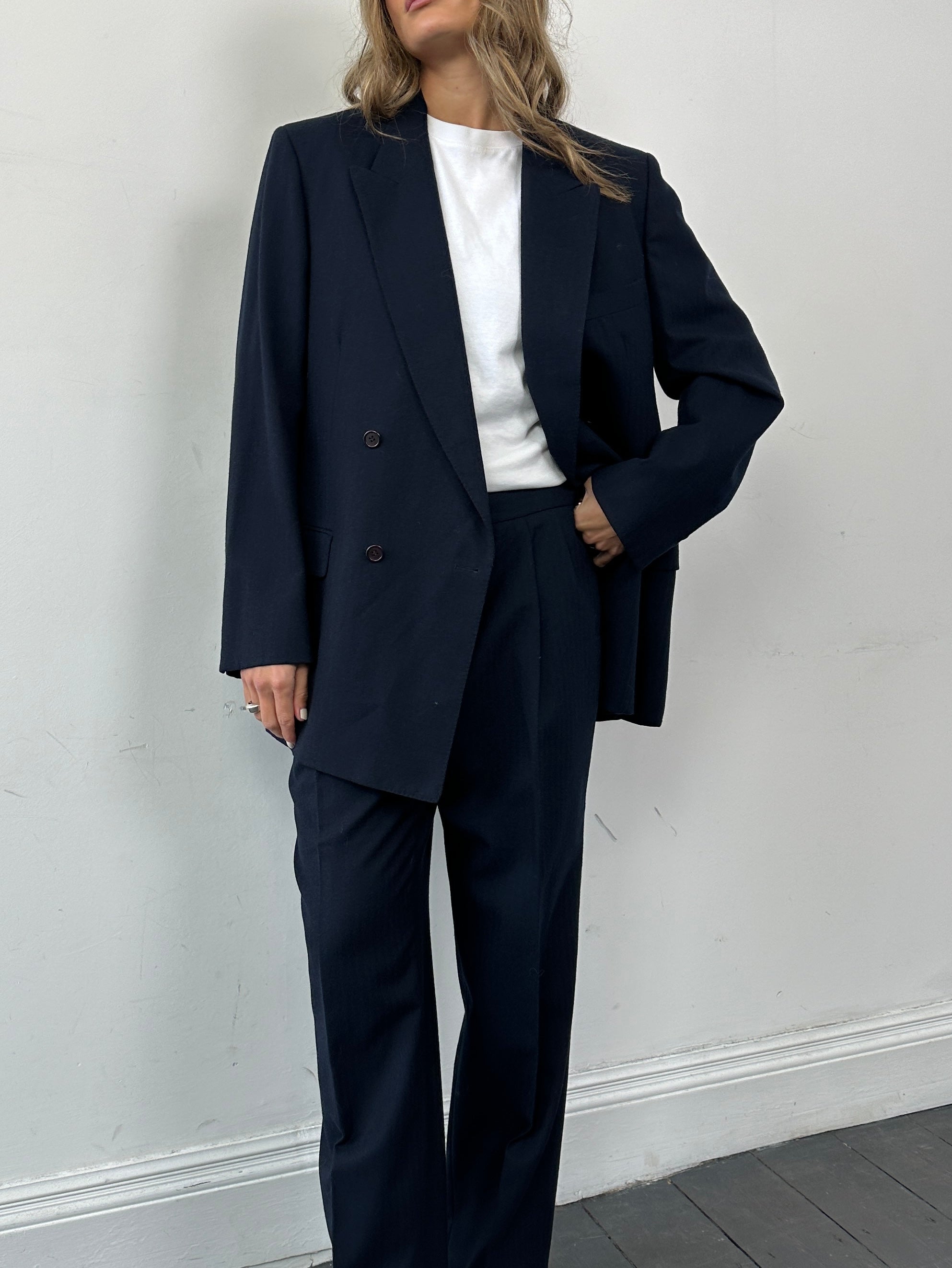 Christian Dior pure wool double-breasted suit jumpsuit in size 43R/W32, featuring tailored lapels and structured fit.