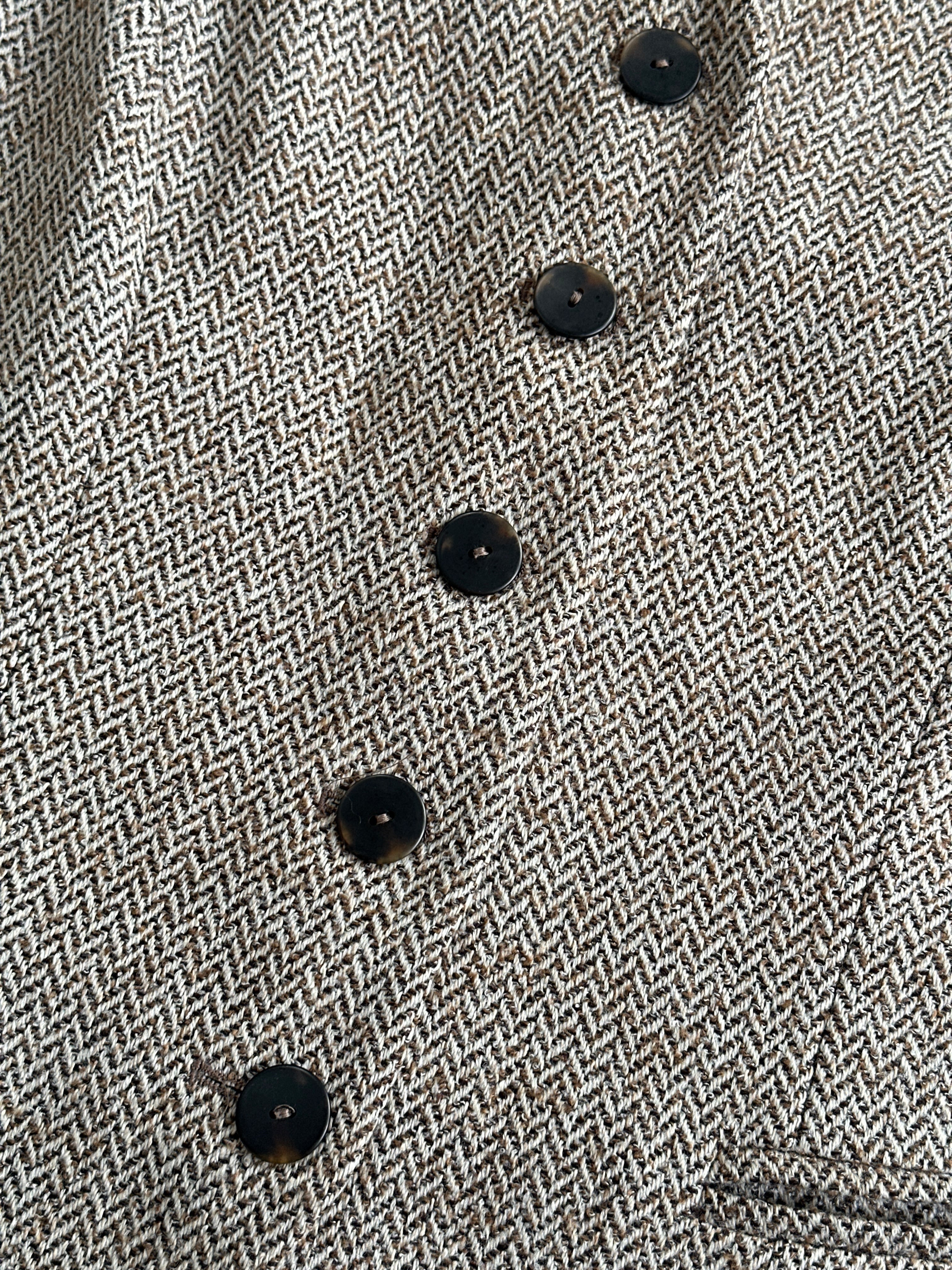 Vintage 1990s virgin wool herringbone waistcoat in size XL, featuring classic pattern and tailored fit.