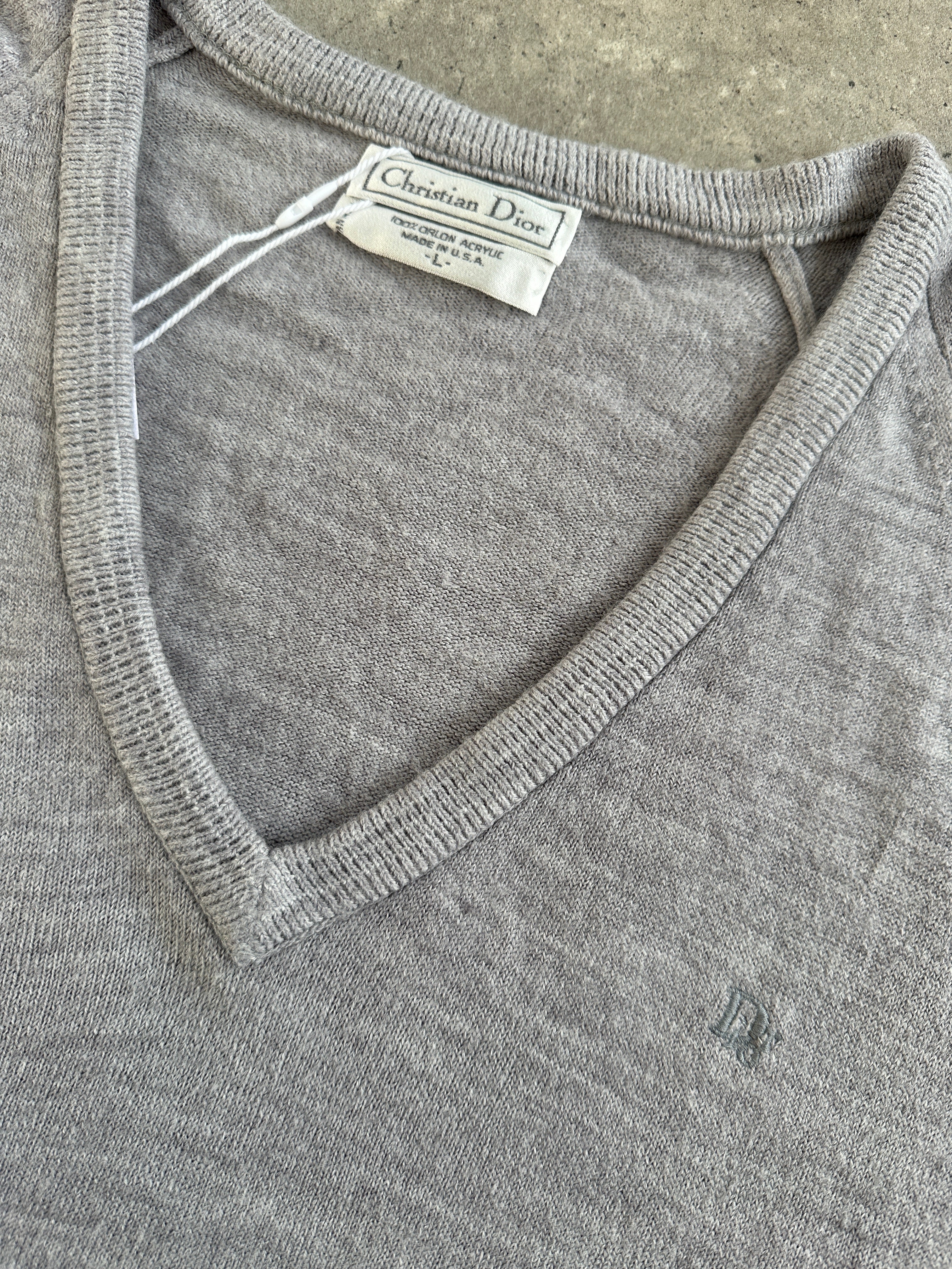 Christian Dior 1980s V-neck logo knitted jumper in size L/XL, featuring a classic design and signature Dior branding.