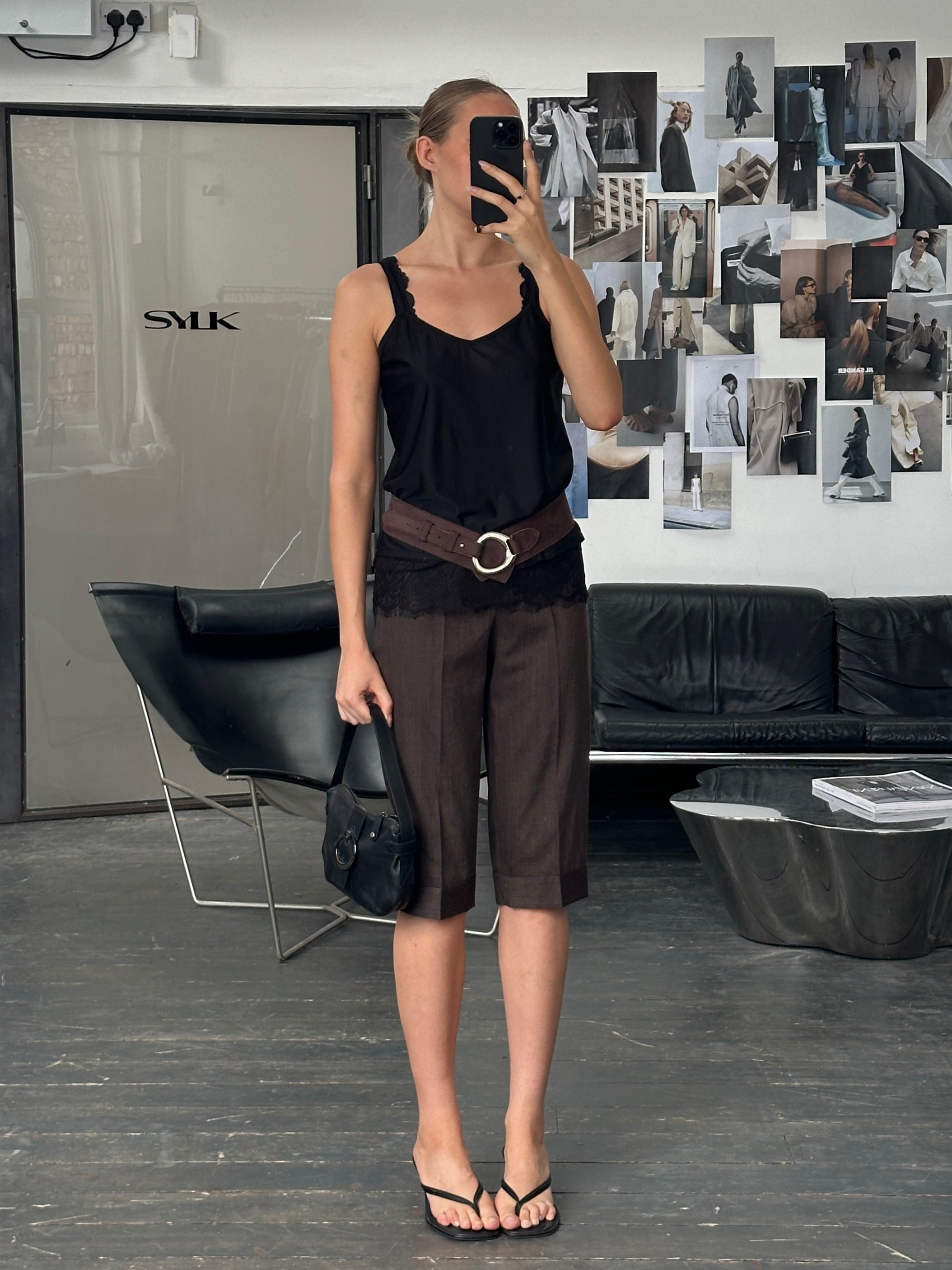 Marella 2000s high-waisted wool Bermuda shorts with tailored fit, shown in beige fabric, size W26, on a hanger.
