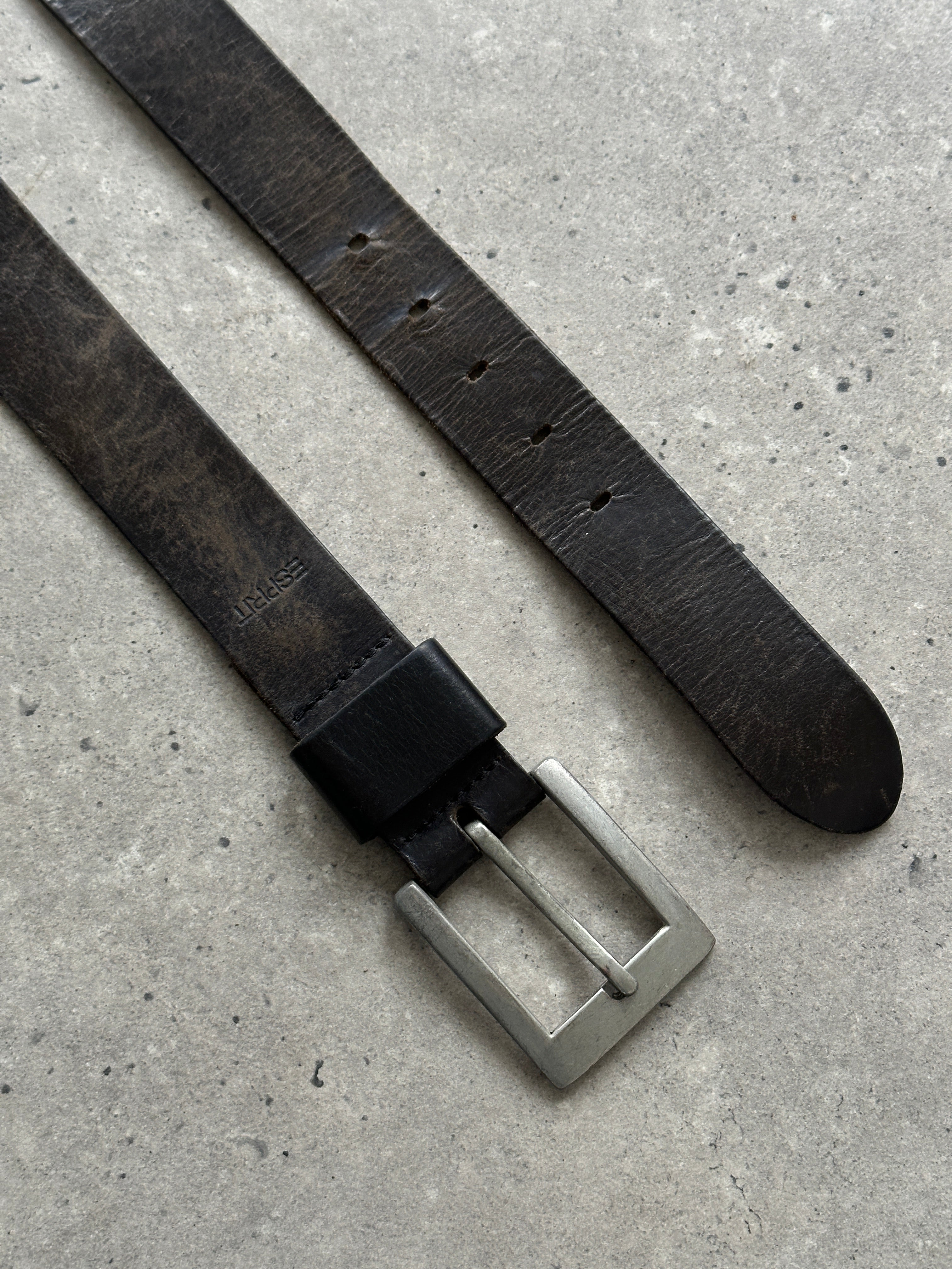 Vintage distressed leather belt in W34-37 size with rugged finish, showcasing a classic design and metal buckle.