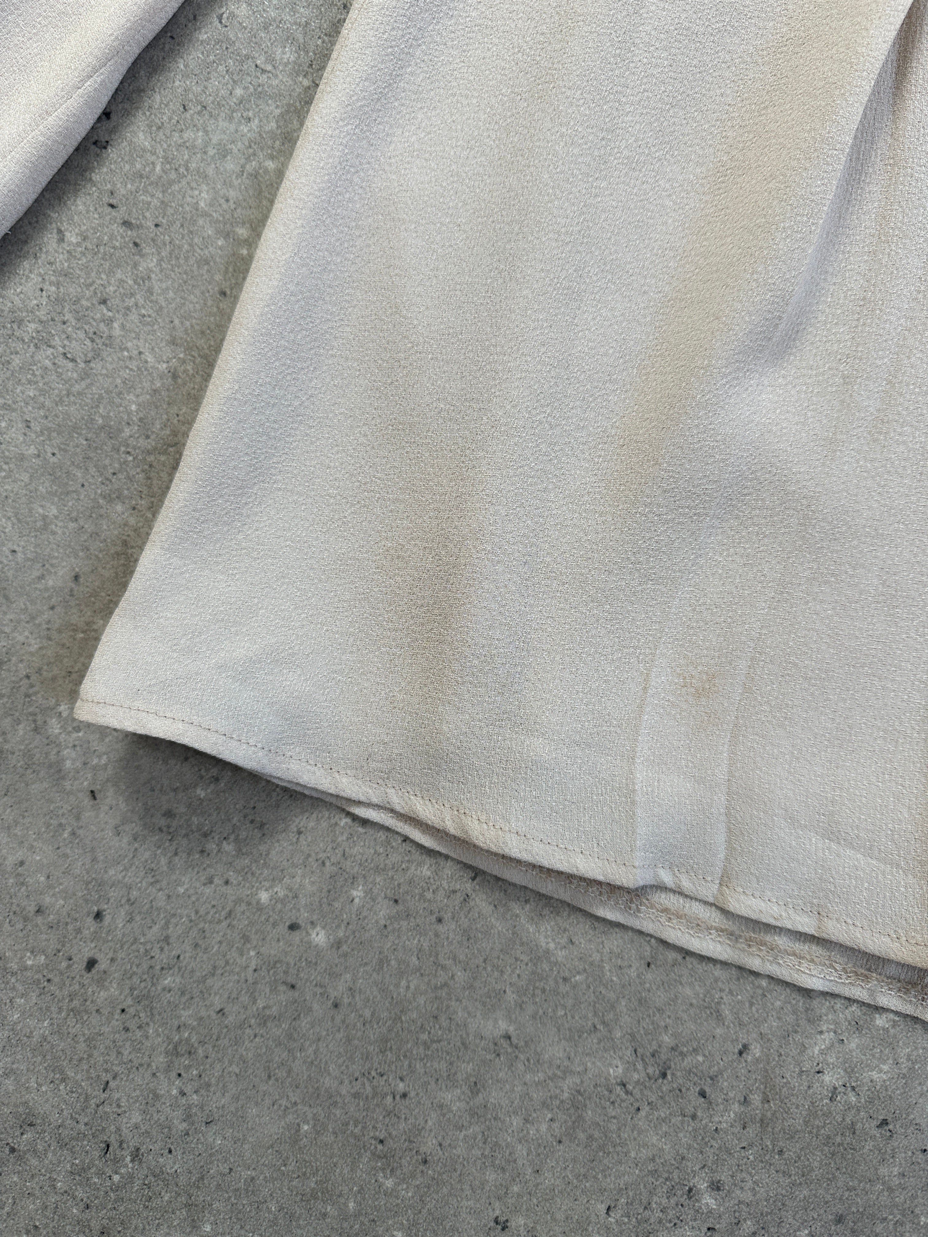 Armani Collezioni 2000s tailored palazzo pleated wide-leg trousers in size 30, shown on a hanger with fabric details.