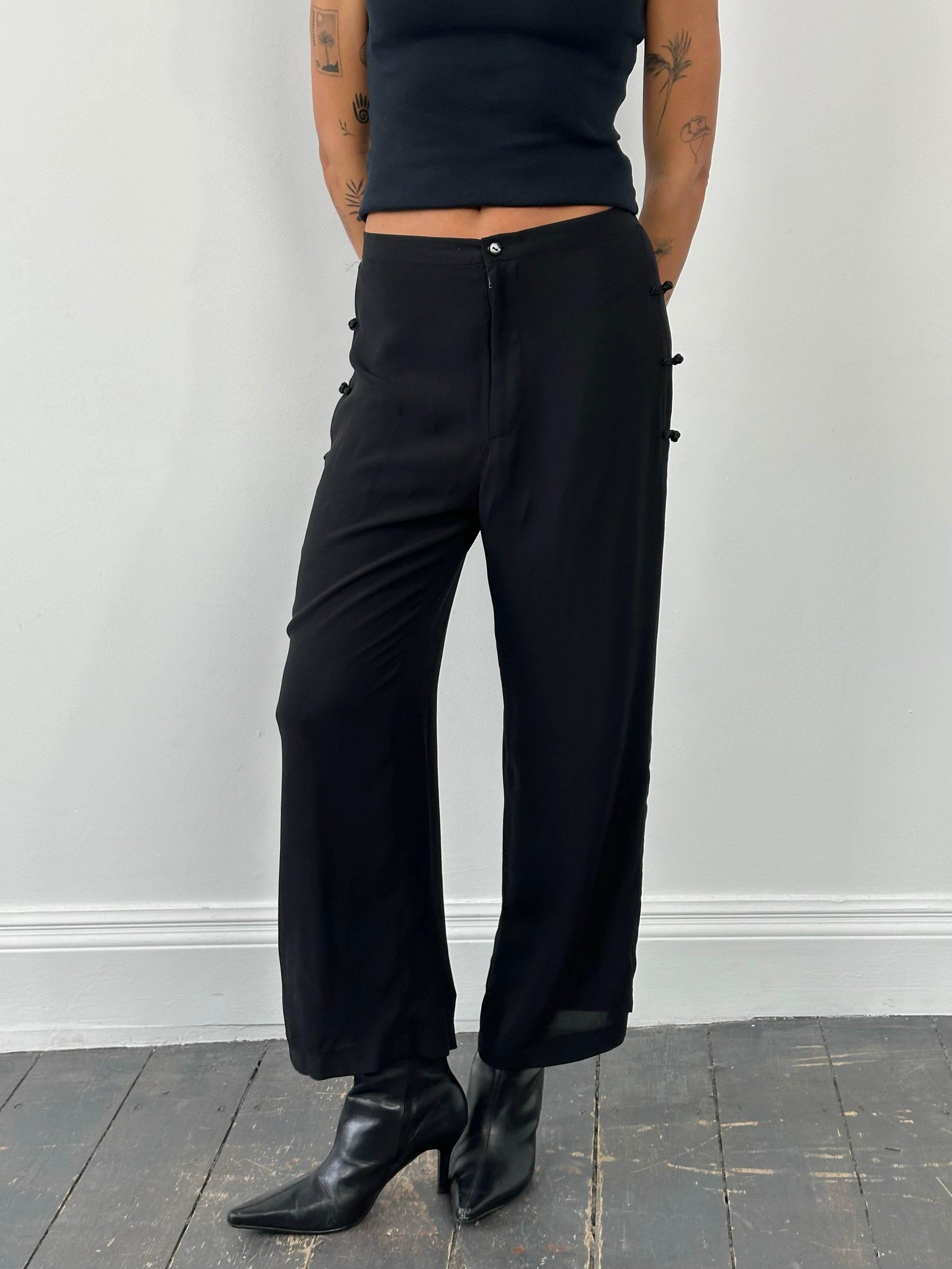 Vintage 1990s pure silk wide-leg trousers in W28, showcasing luxurious fabric and classic wide-leg style.