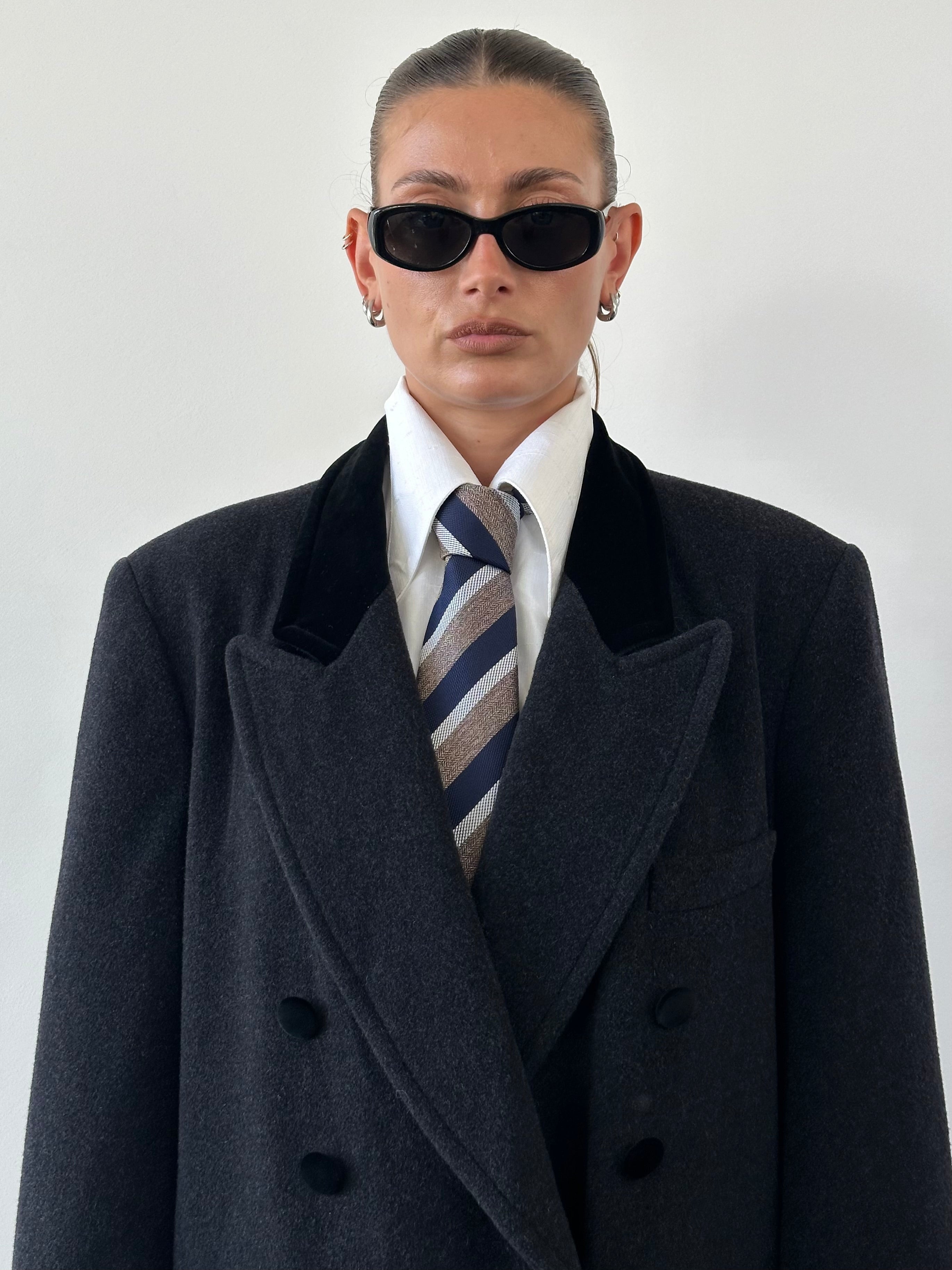 Vintage wool double-breasted tuxedo coat in XL size, featuring classic style and tailored fit, displayed on a hanger.
