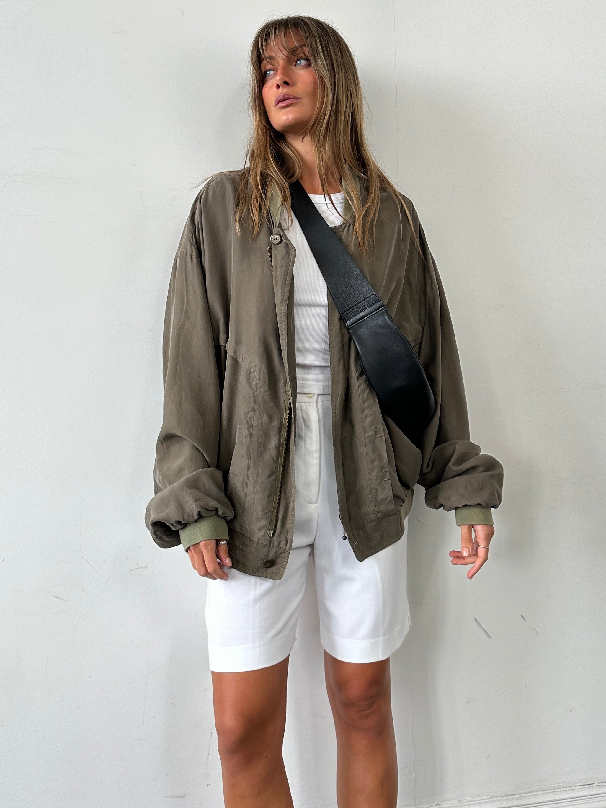 Pierre Cardin XXL pure silk slouchy bomber jacket featuring a relaxed fit and sleek design, shown on a hanger.