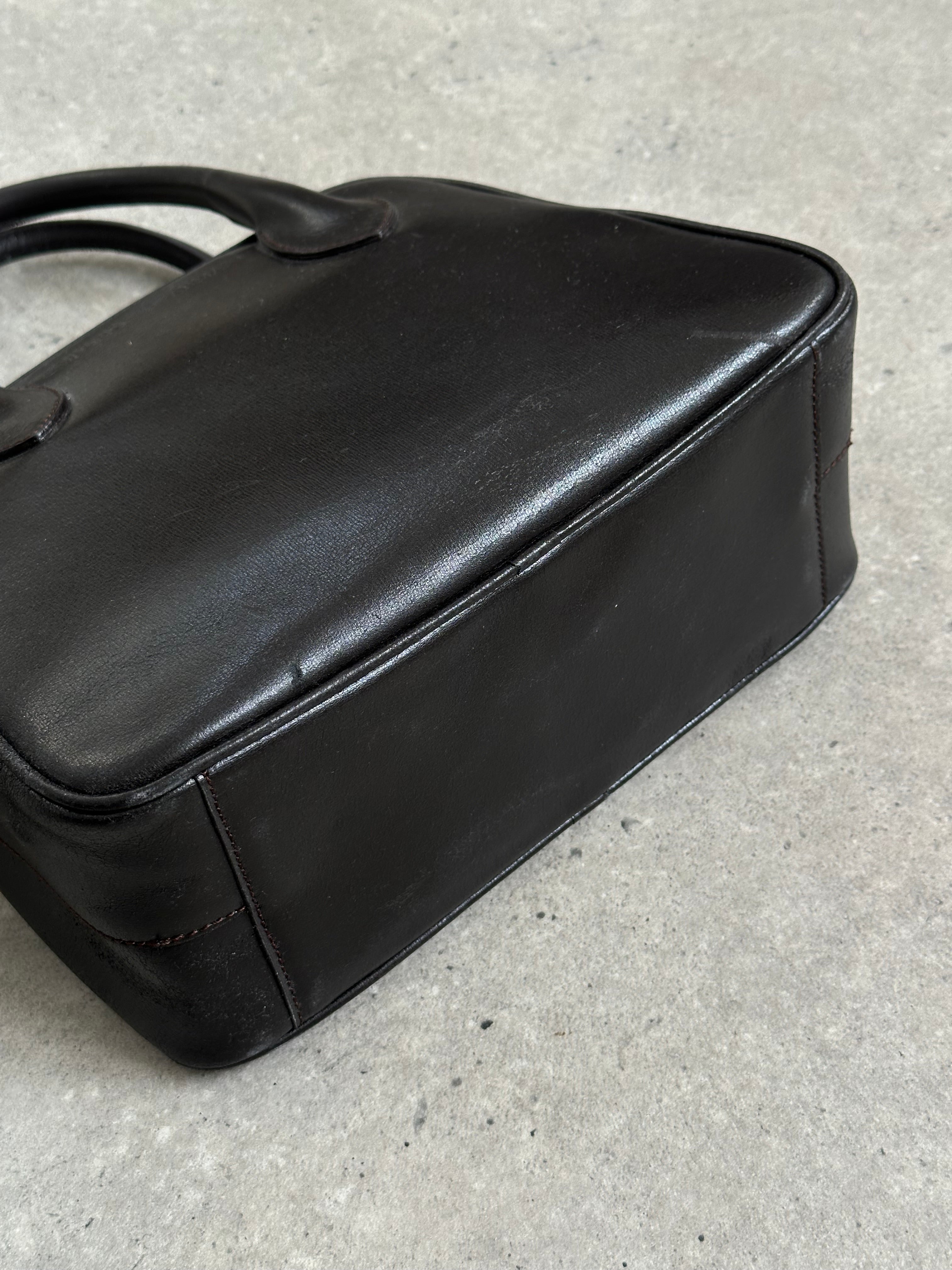 Emporio Armani leather handbag from the 2000s, featuring a sleek design with embossed logo and classic brown leather finish.