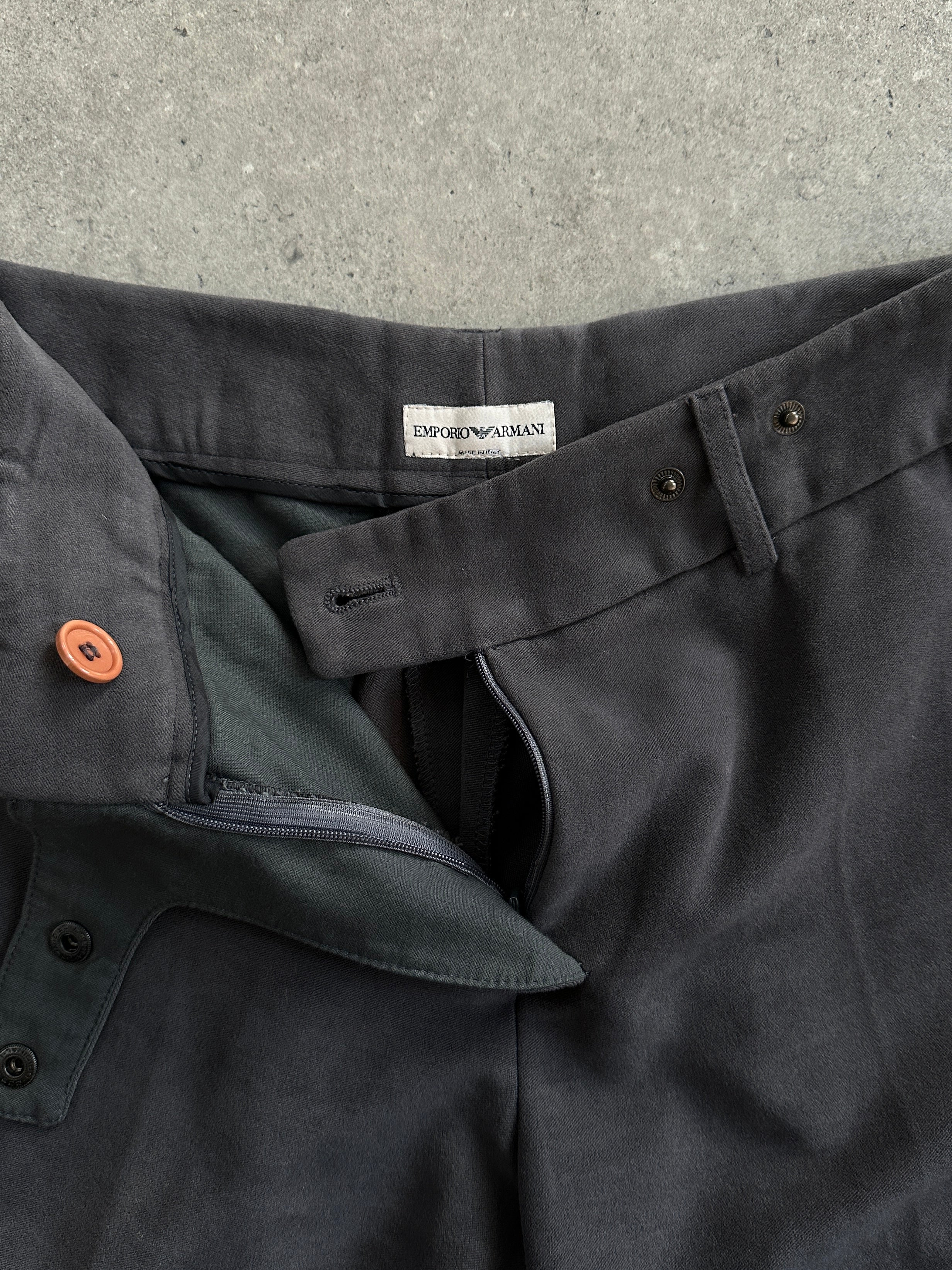 Emporio Armani wide-leg low-rise trousers in dark fabric, front view showing relaxed fit and stylish design.