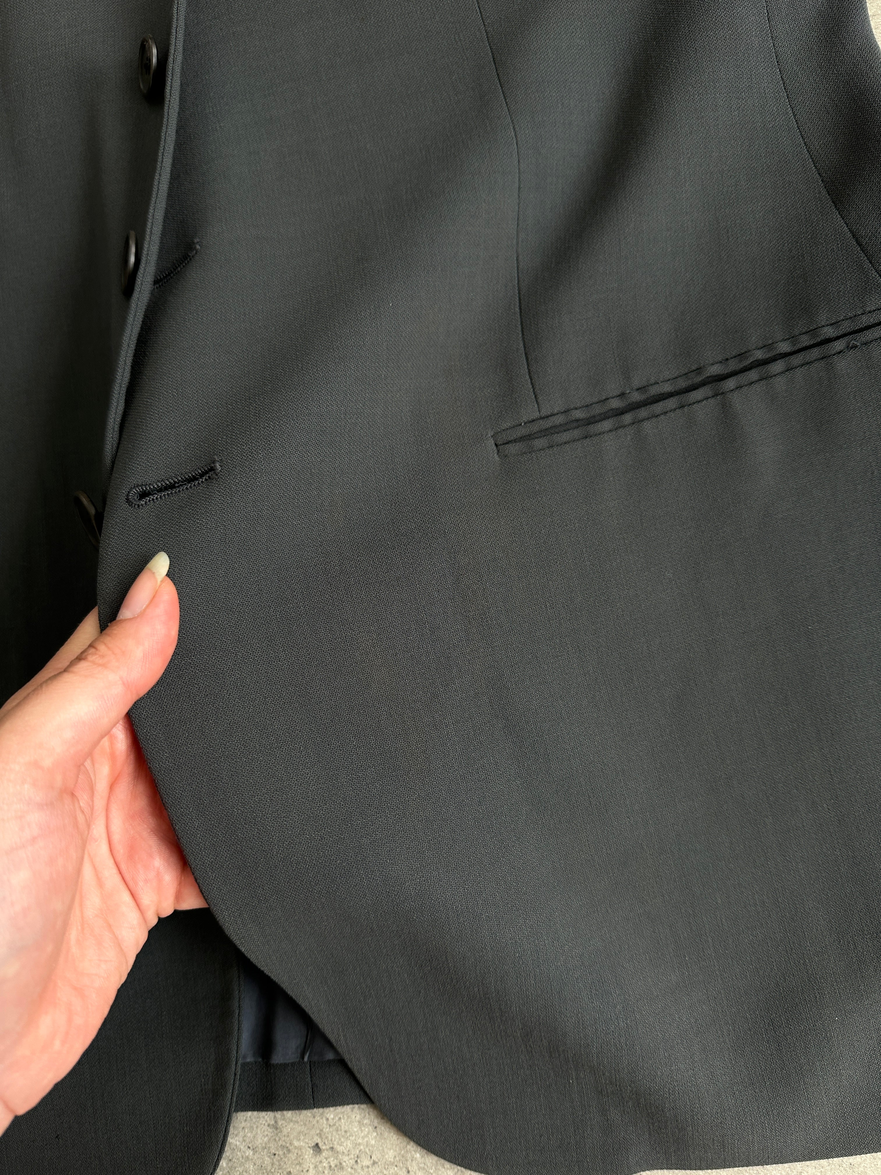 Giorgio Armani Le Collezioni wool relaxed single-breasted suit jumpsuit in size 42R/W34, tailored fit with classic lapels and pockets.