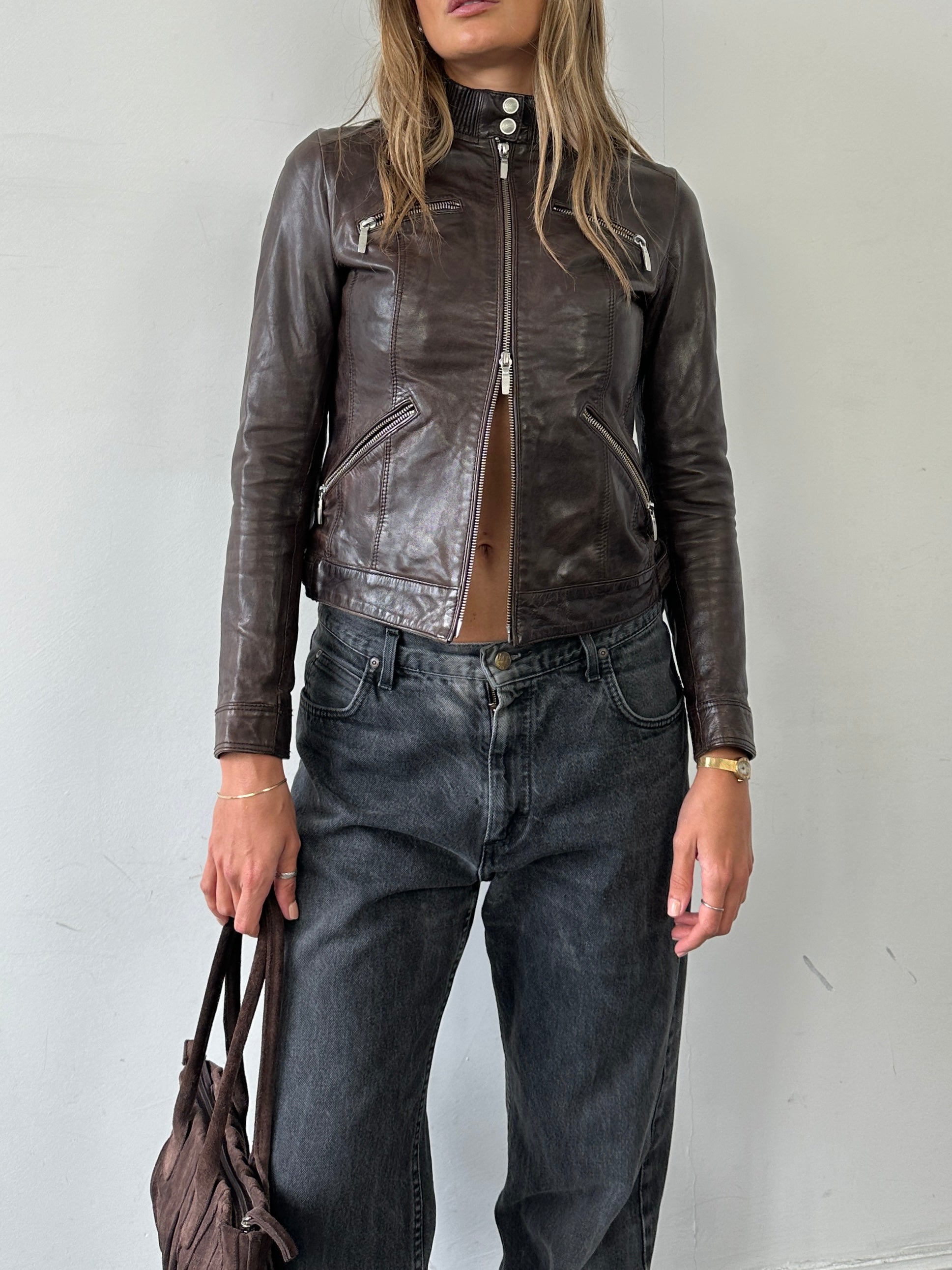 Vintage double zip fitted biker leather jacket in XS/S, showcasing classic design with silver hardware and a sleek, fitted silhouette.