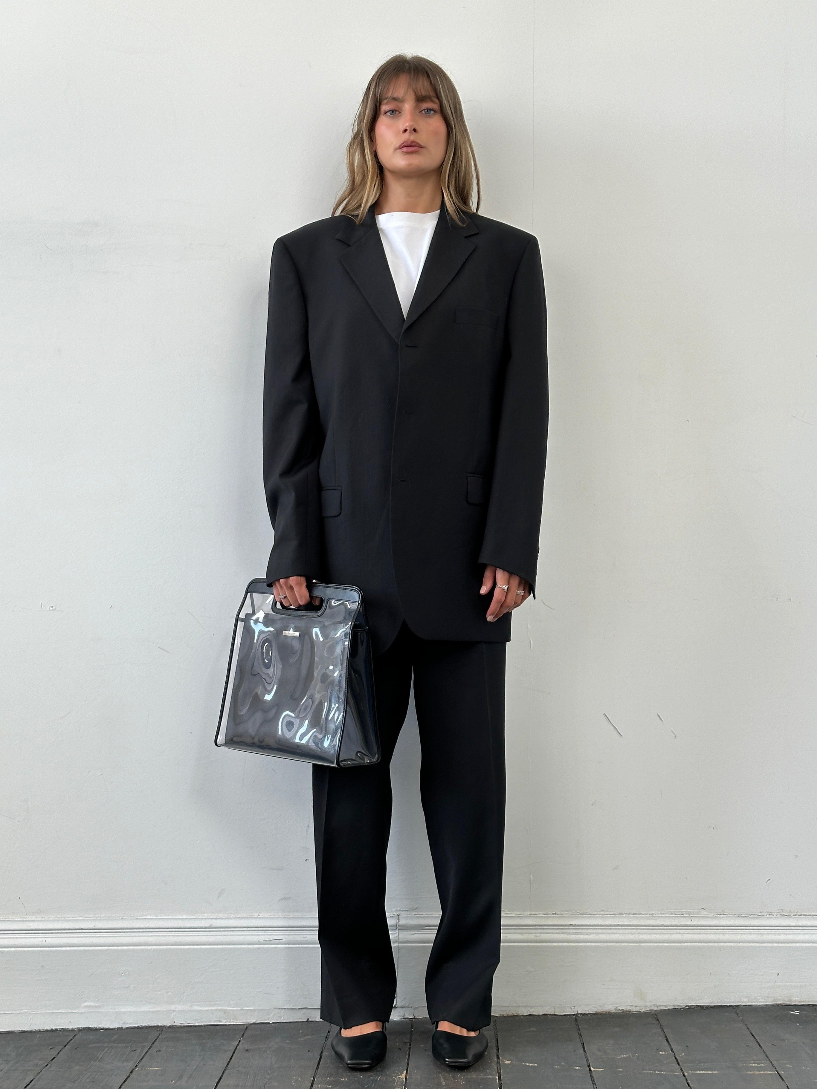 Yves Saint Laurent Pour Homme pure wool single-breasted suit in size 46R/W38, shown on a mannequin, with classic tailored fit.