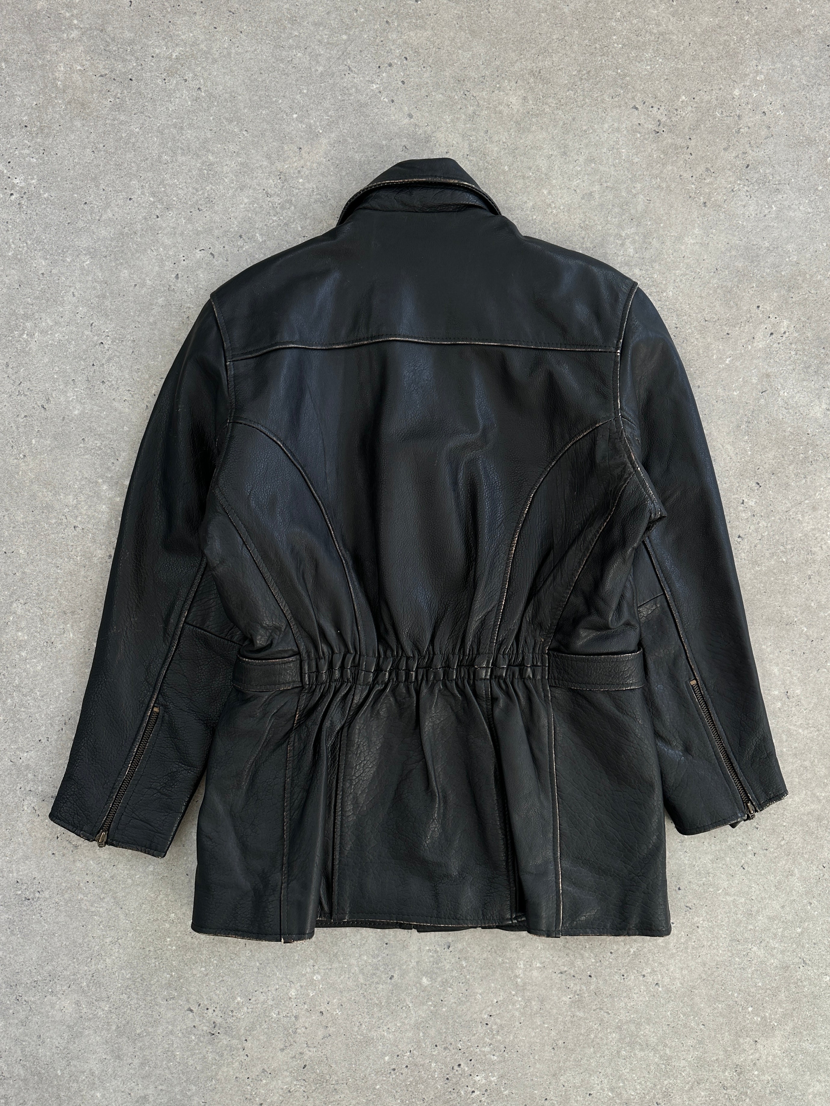 Vintage 1980s aviator belted leather jacket in black, featuring classic design, metal buckle, and rugged style.