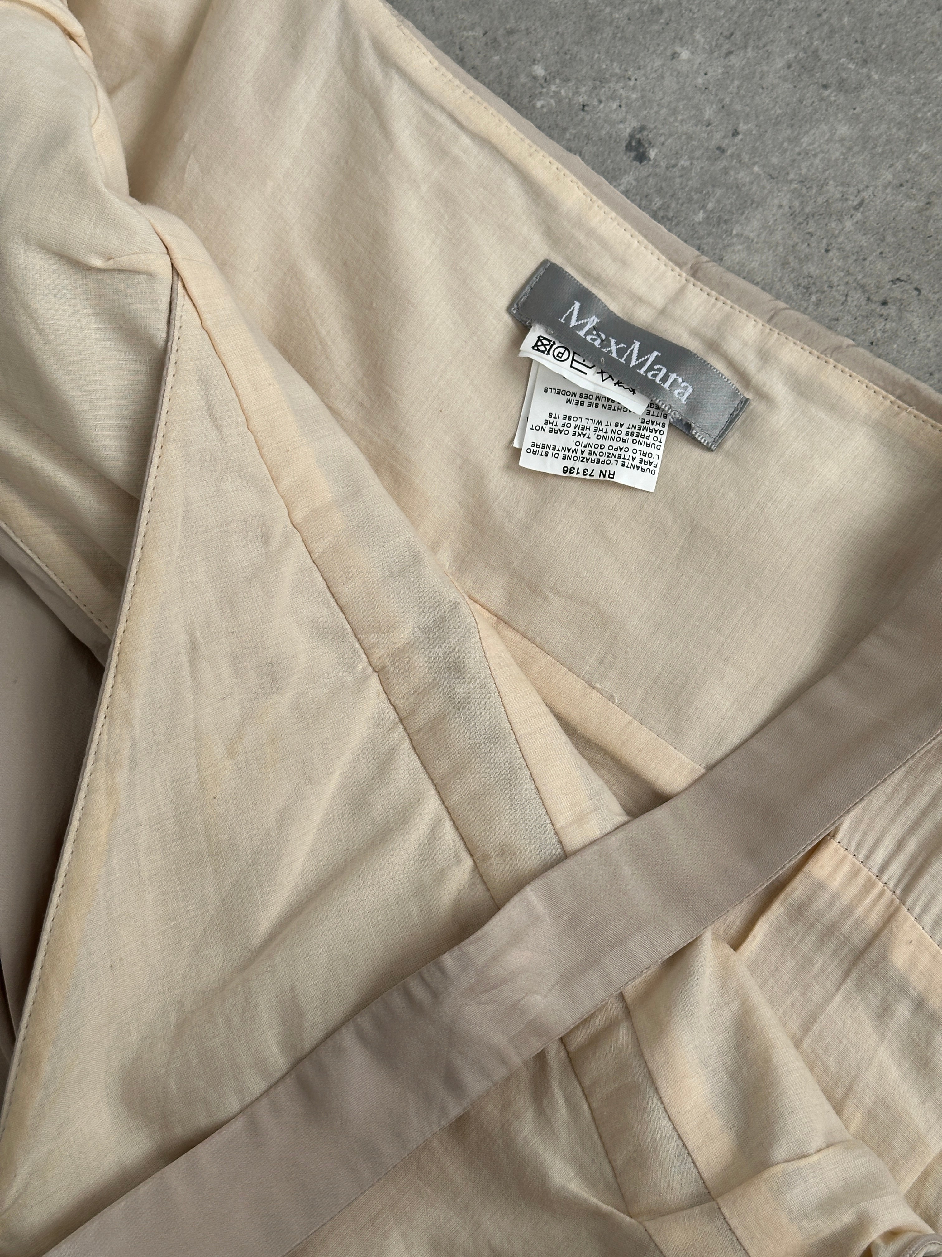 Max Mara silk mini dress with asymmetric bubble hem in a sleek, elegant design, size M/UK10, showcased on a dress form.