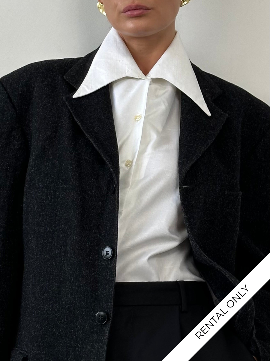 Vintage 1970s Dagger Collar Shirt in black with button-front and long sleeves, displayed flat on a white background.