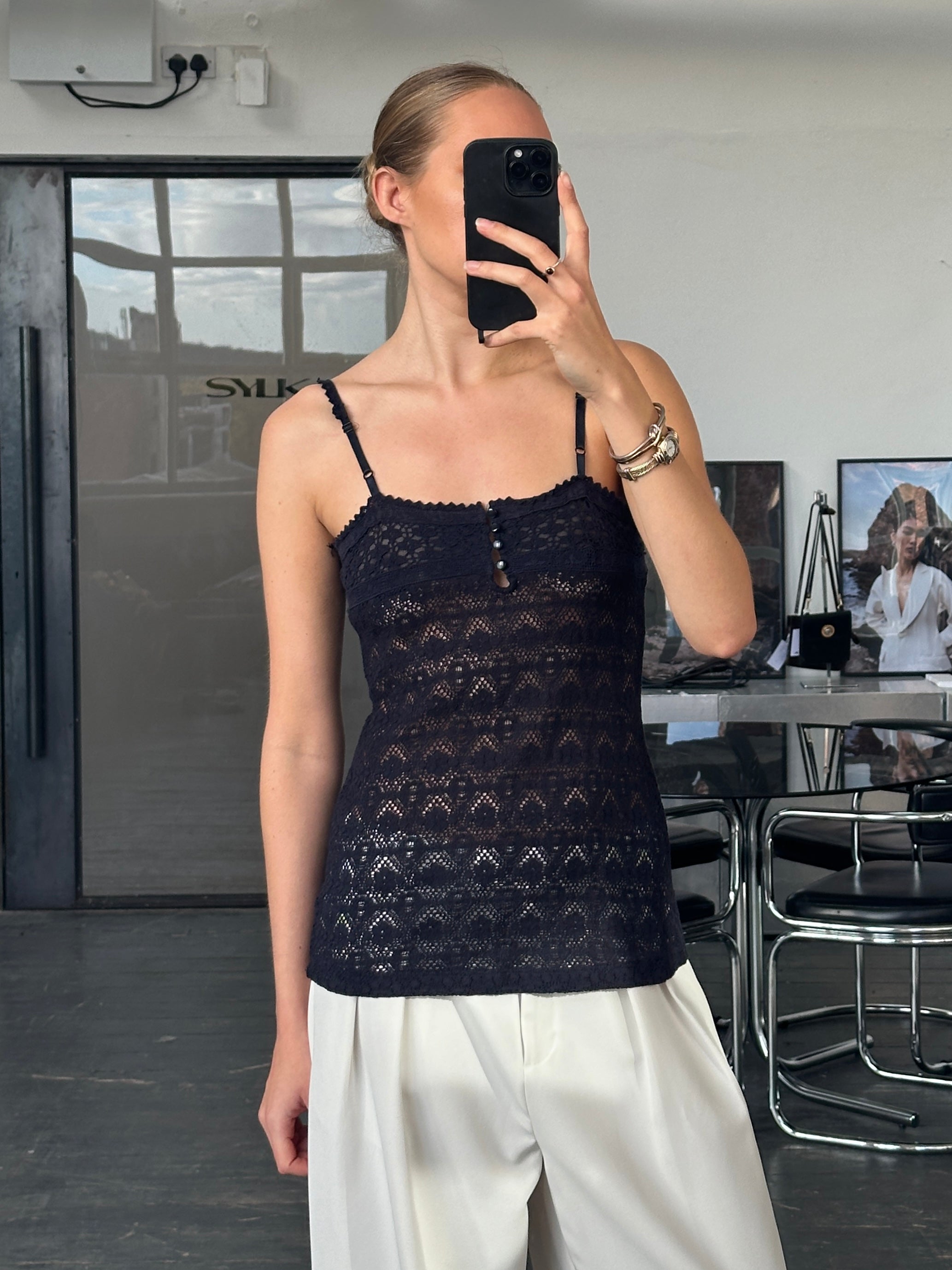 Vintage 2000s crochet cami top in black, featuring delicate knit detailing, ideal for casual or layered summer outfits.