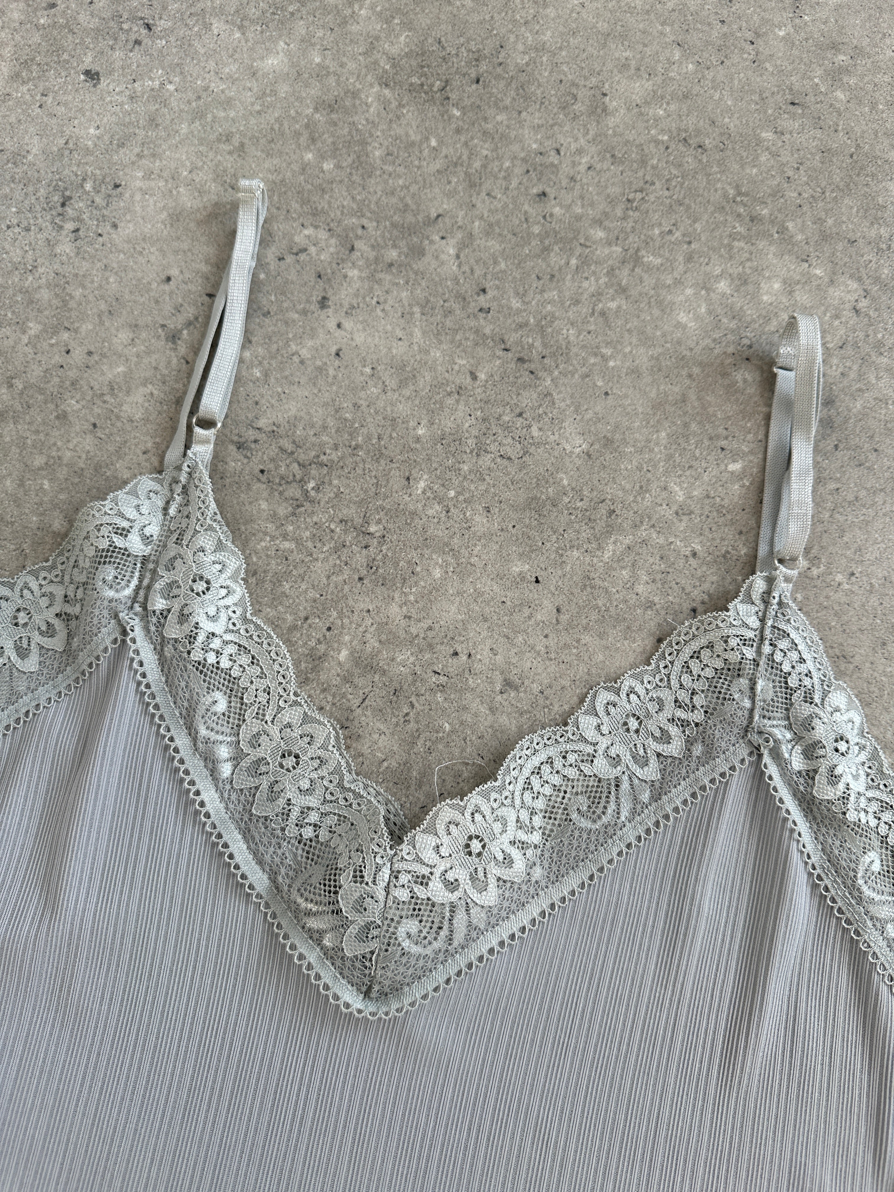 Italian Vintage 1990s lace sheer mini slip dress, size S, featuring delicate lace fabric and a vintage-inspired design.