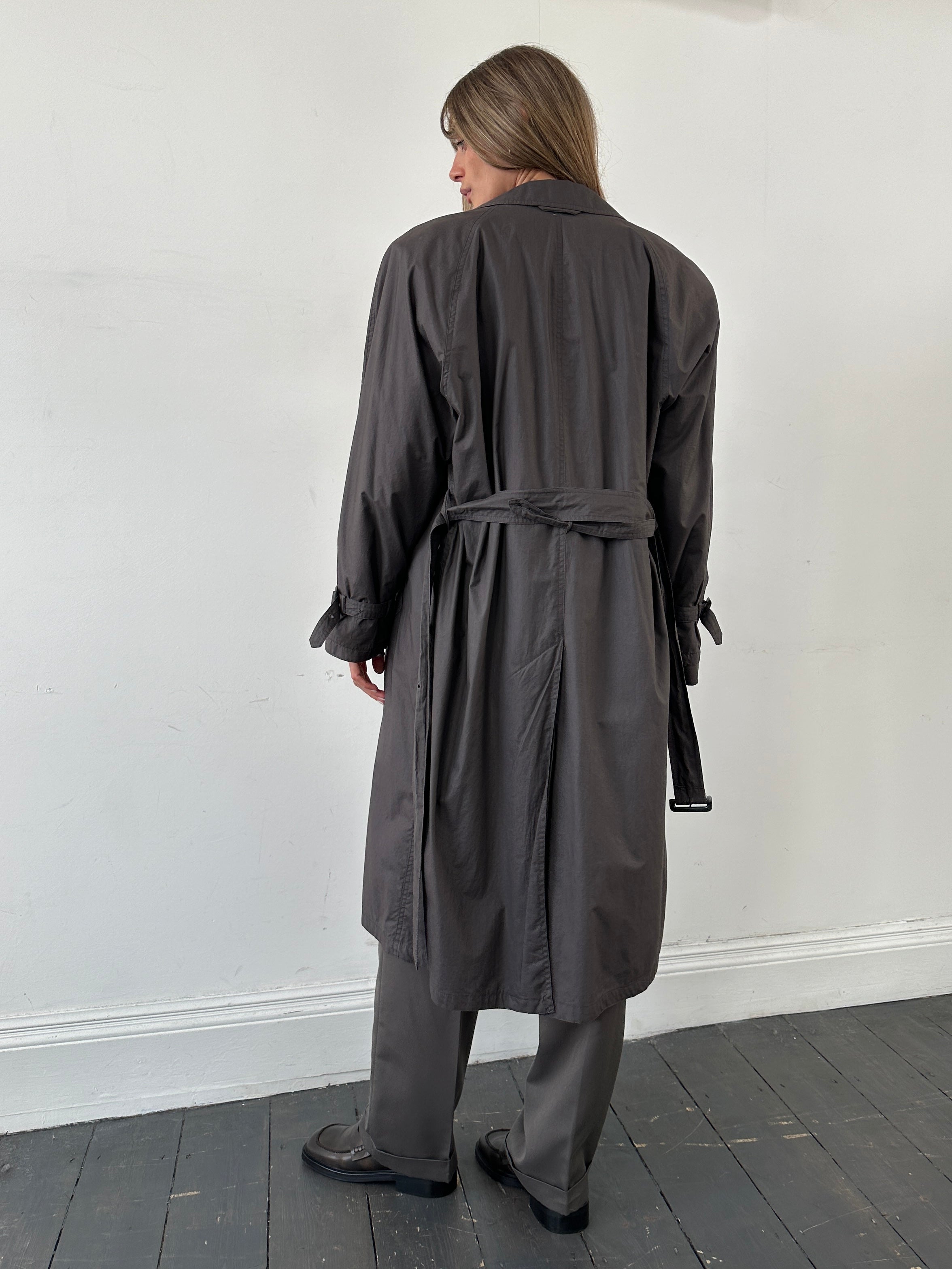 Vintage double-breasted unlined belted trench coat in size L, lightweight classic coat with lapels and side pockets.