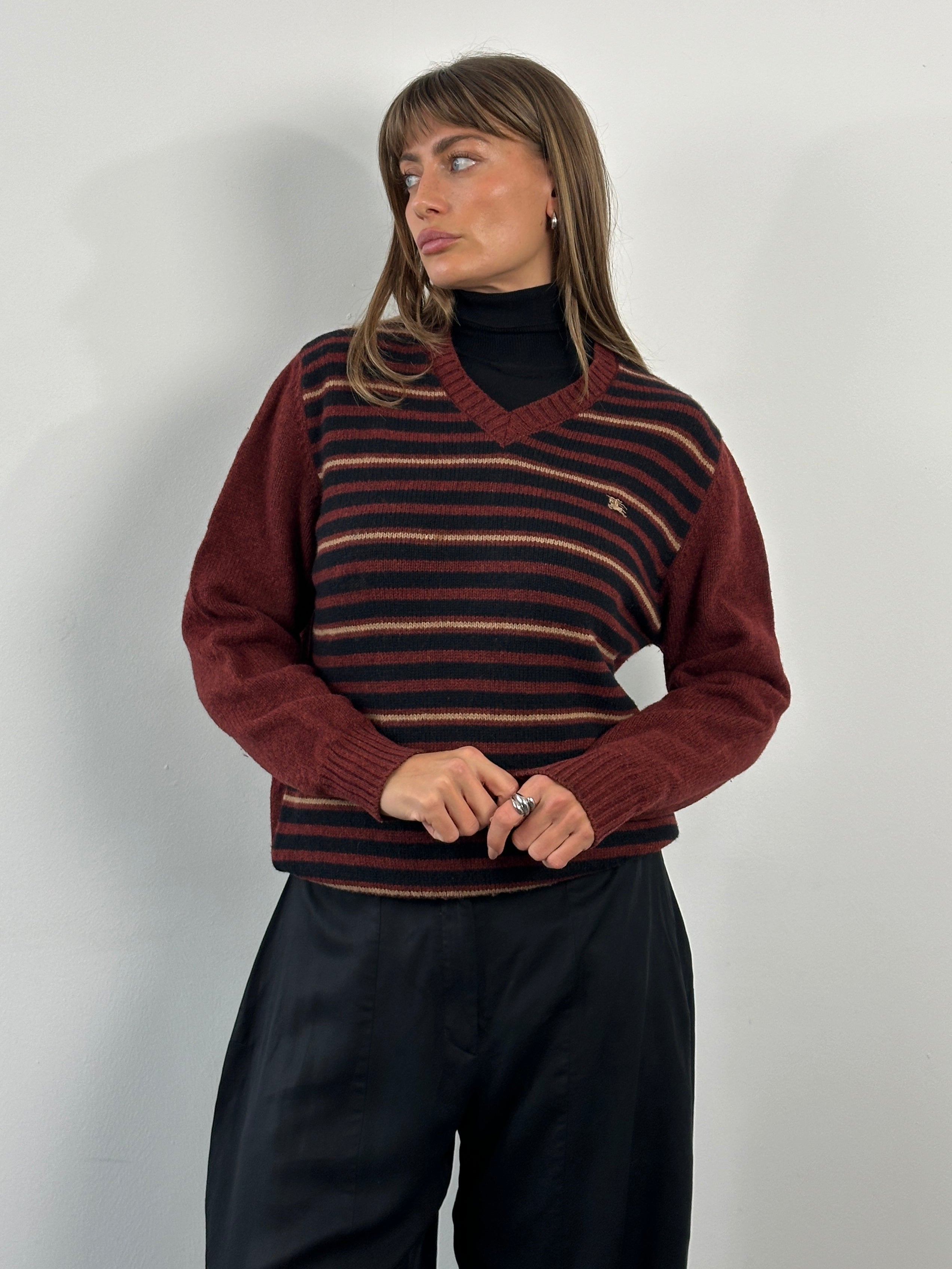Burberry London 2000s lambswool V-neck striped jumper in size M/L, featuring classic pattern and cozy knit fabric.