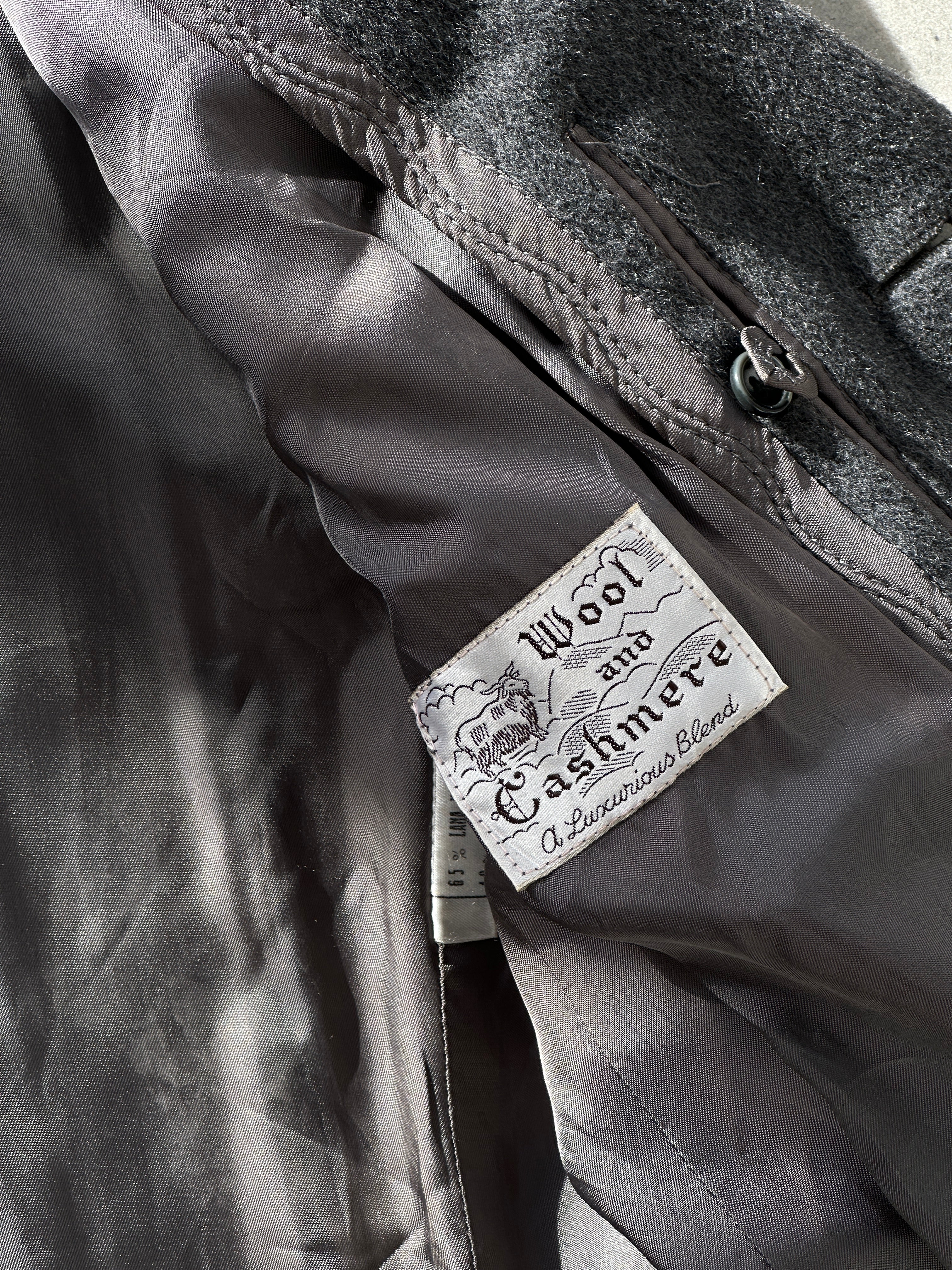 Vintage wool cashmere coat in S/M, shown on model, featuring classic design and cozy texture.