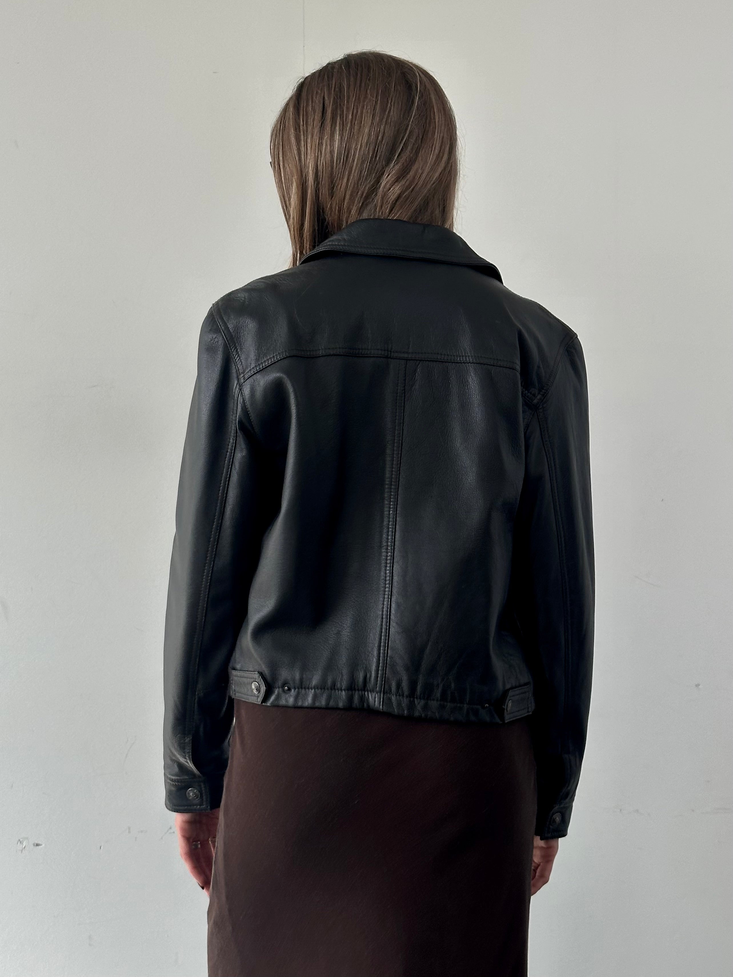 Armani Jeans black leather jacket for men, stylish S/M size, featuring smooth leather with subtle stitching details.