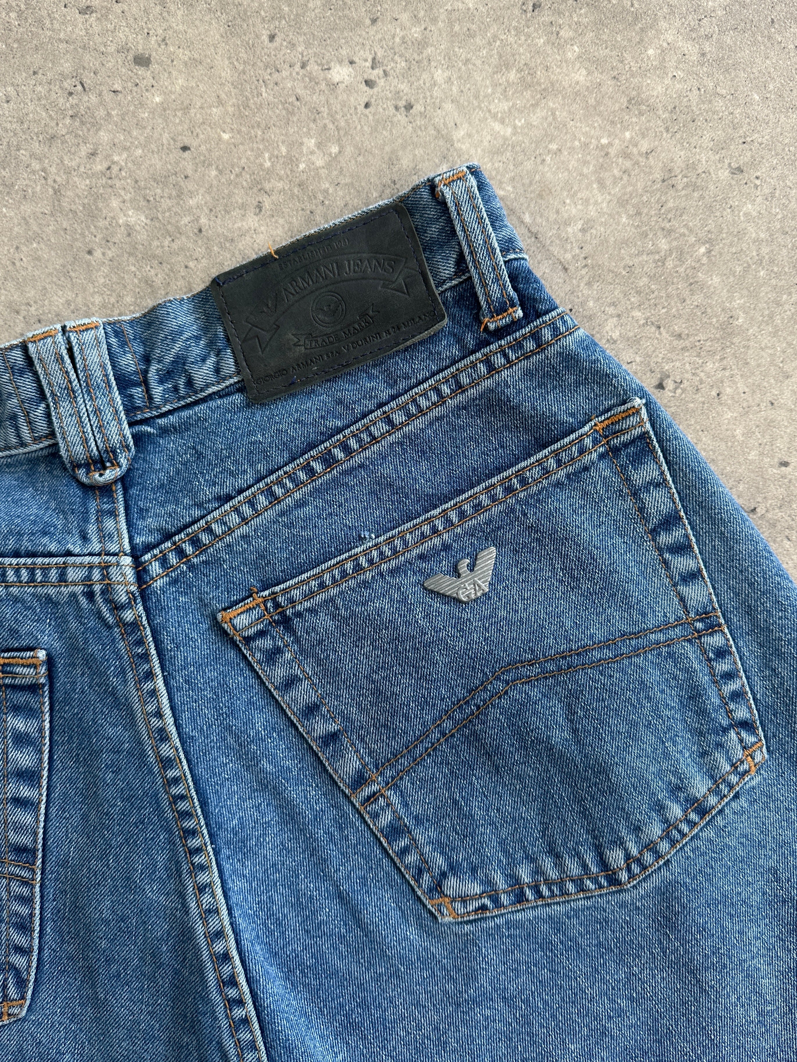 Armani Jeans mid wash tapered leg high waisted denim jeans, front view, showing classic five-pocket design and subtle fading details.