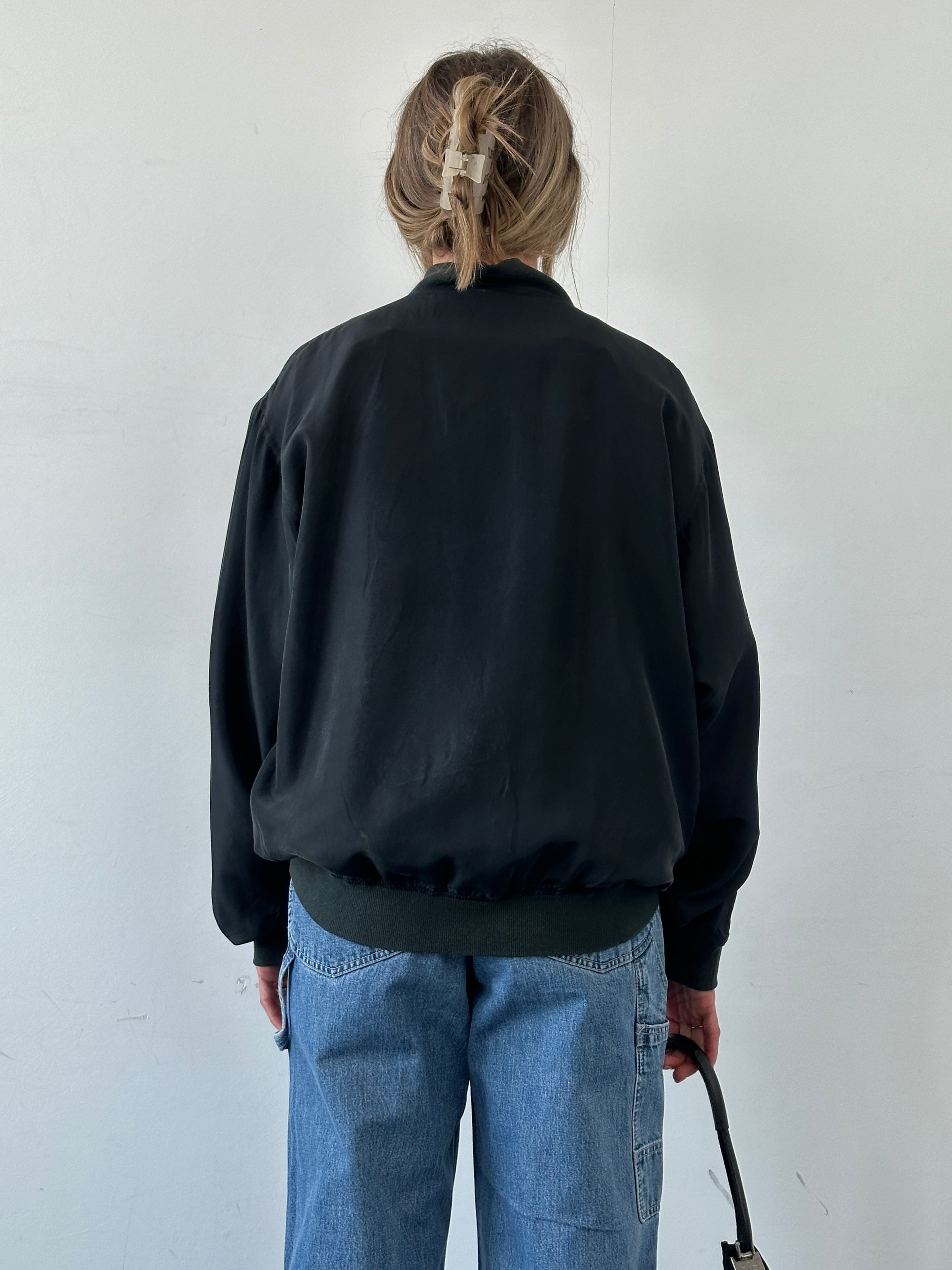 Vintage pure silk bomber jacket in XL style, featuring a sleek design and smooth fabric, perfect for stylish casual wear.