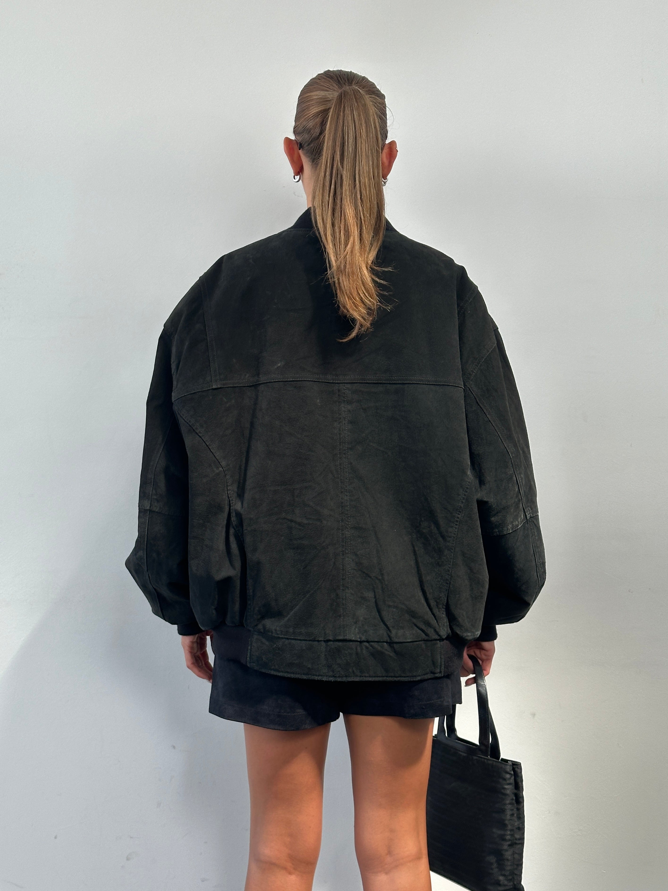 Vintage brand vintage suede bomber jacket in XXL, showing classic leather jacket with soft suede texture and ribbed collar.