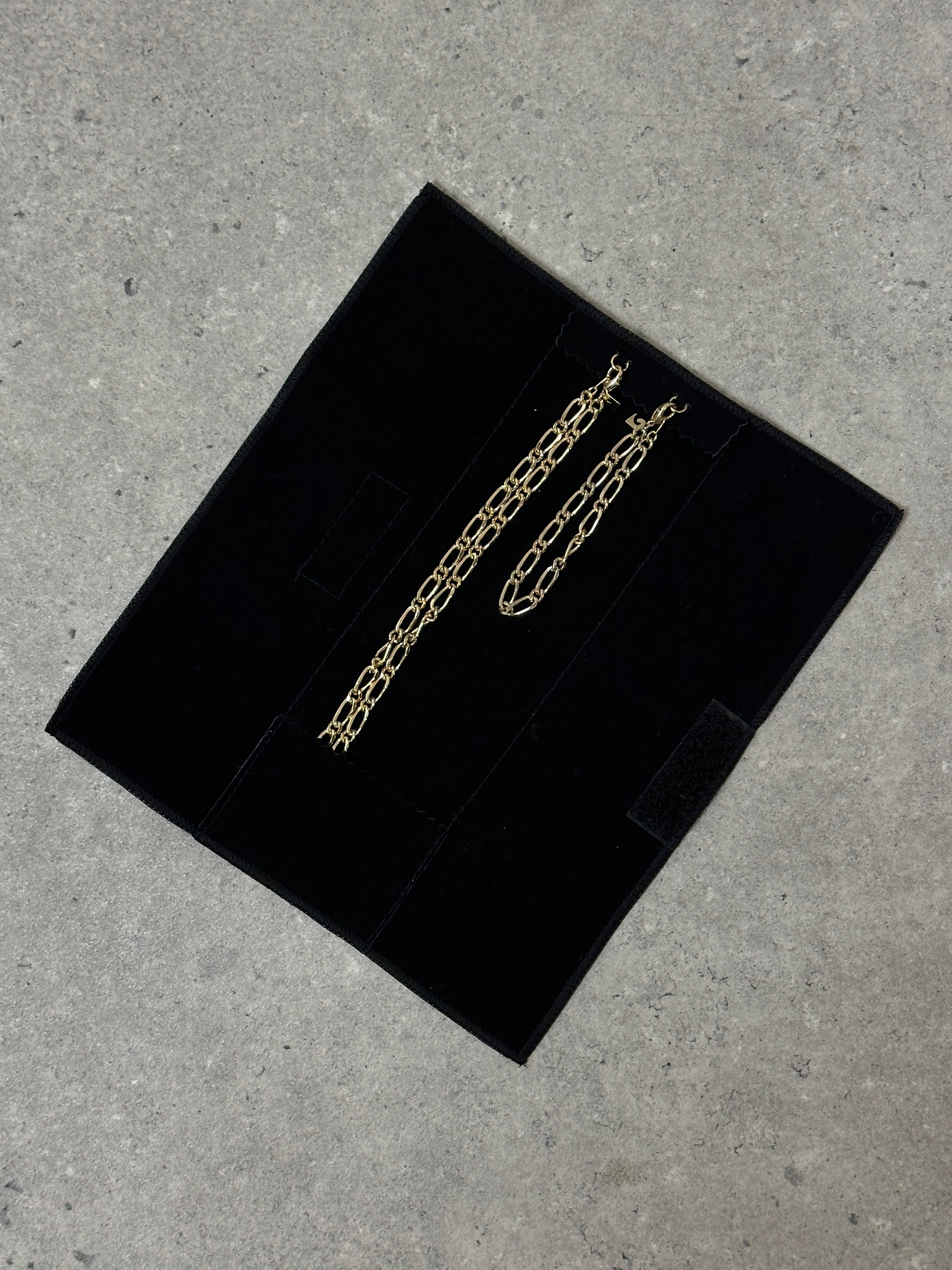 Pierre Cardin gold plated necklace and bracelet chain set with sleek, matching jewelry designs displayed on a neutral background.