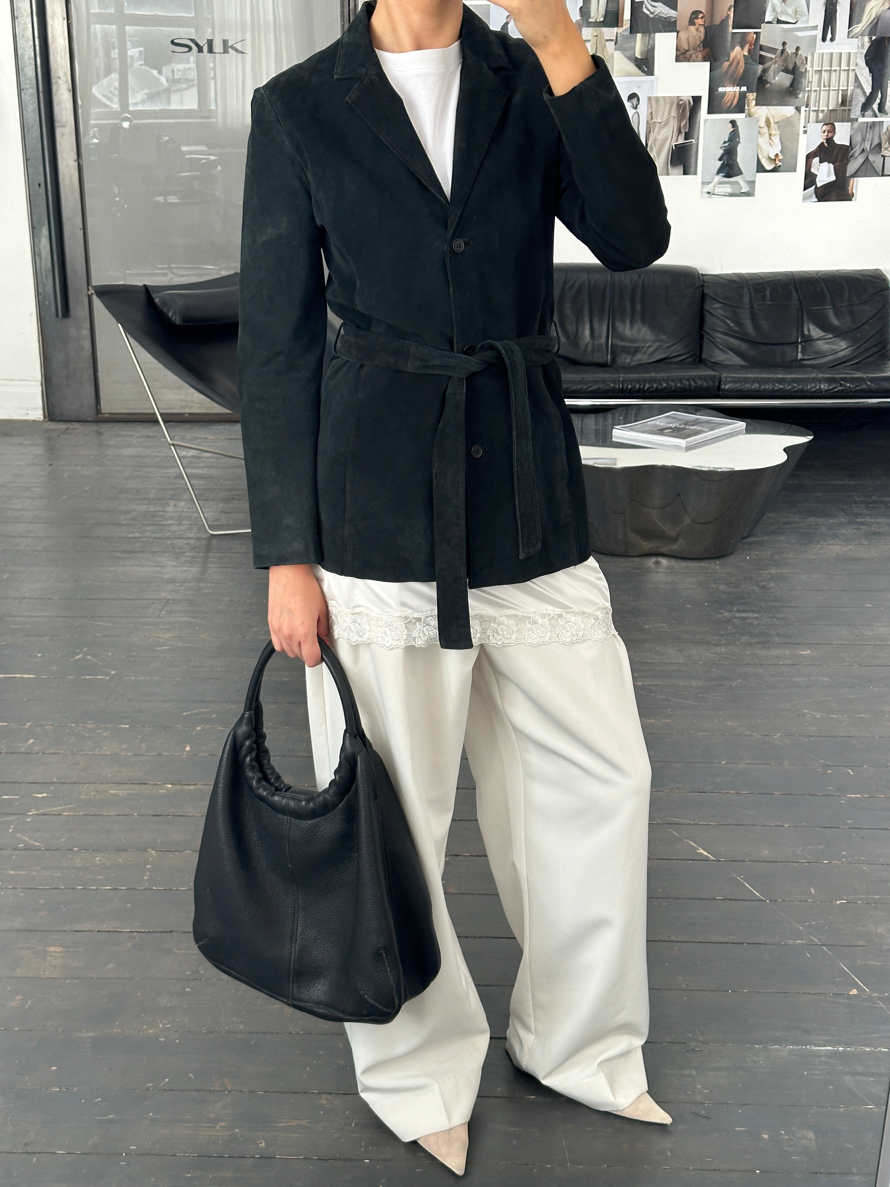 Vintage 1990s suede leather belted jacket with classic style, featuring a fitted silhouette and vintage-inspired design.