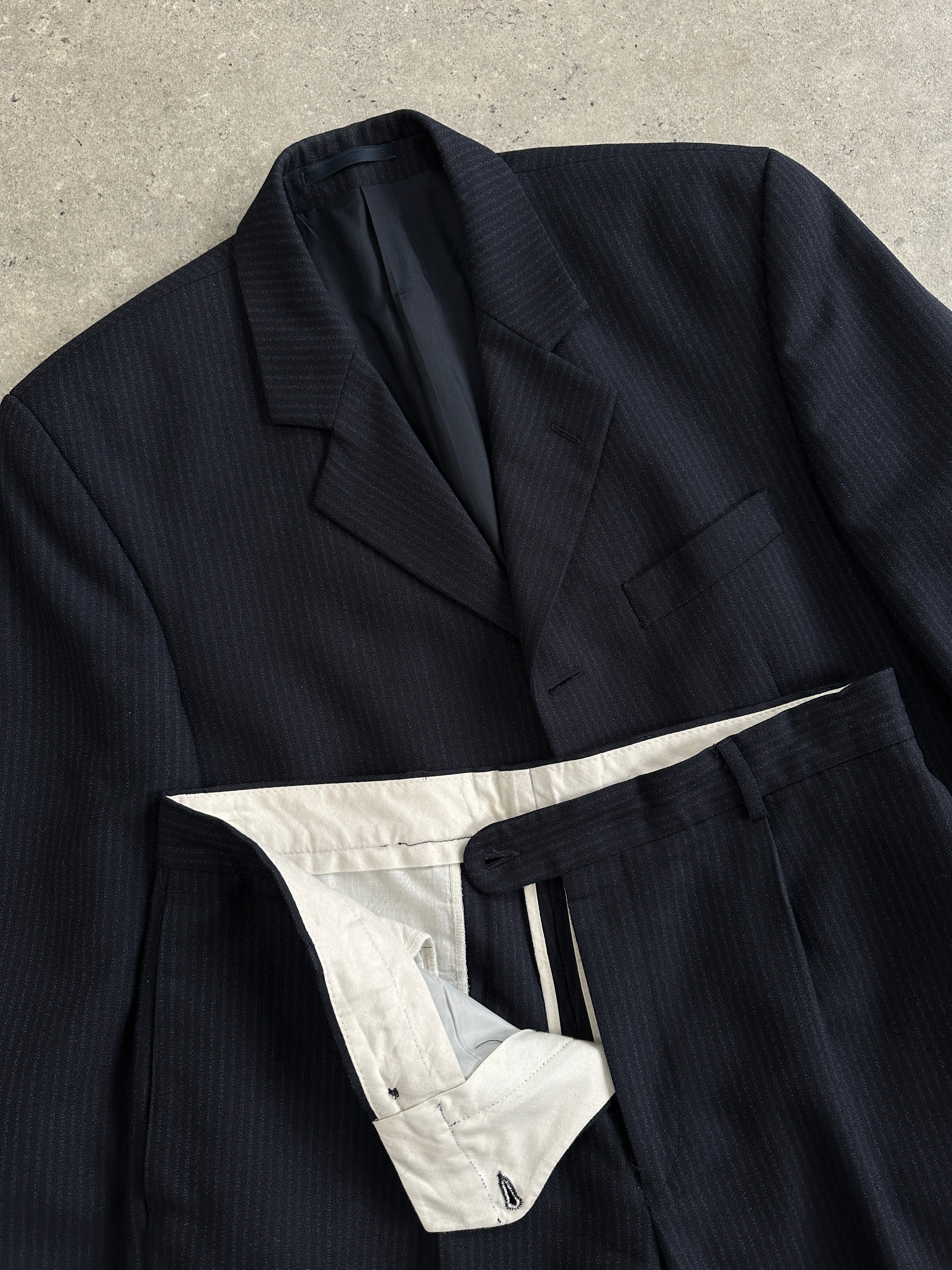 Vintage pinstripe wool jumpsuit, single-breasted suit in size 40R/W34, featuring a classic vintage design and tailored fit.