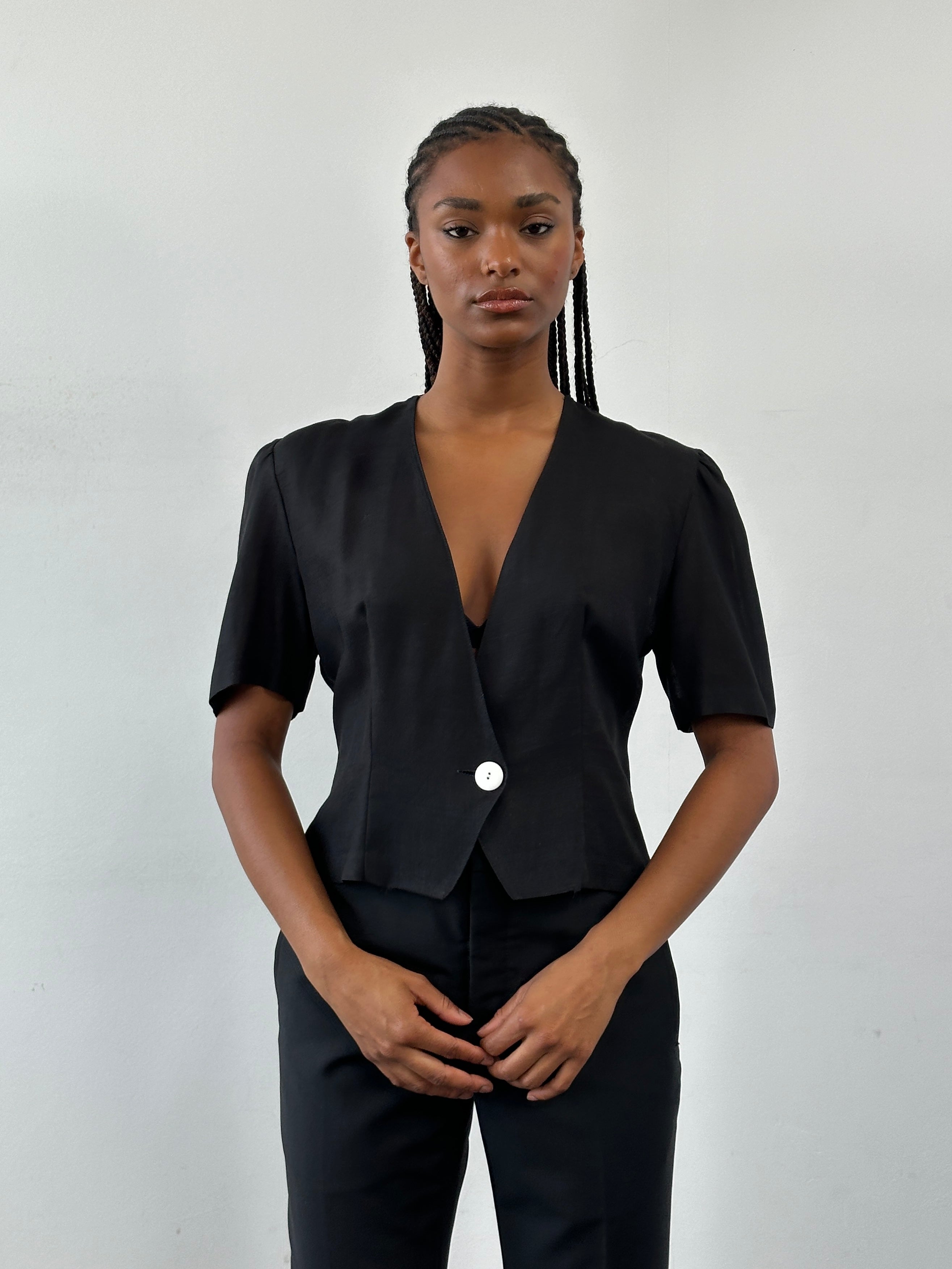 St Michael 1987 cropped short sleeve blazer in black, featuring a tailored fit and stylish design, displayed on a mannequin.