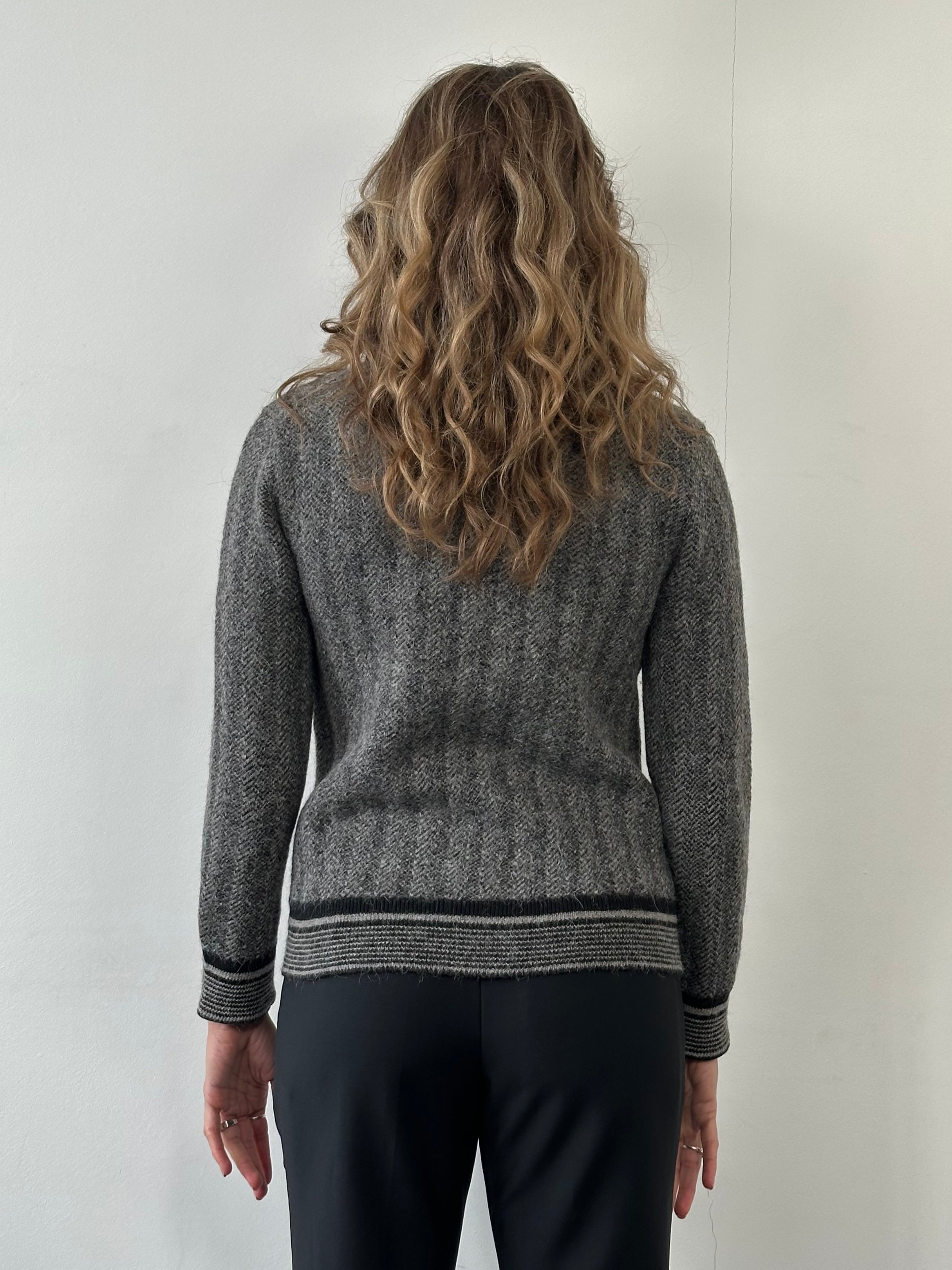 Gucci wool mohair logo patch cardigan in size small, featuring a knit design with a prominent Gucci logo patch on the front.
