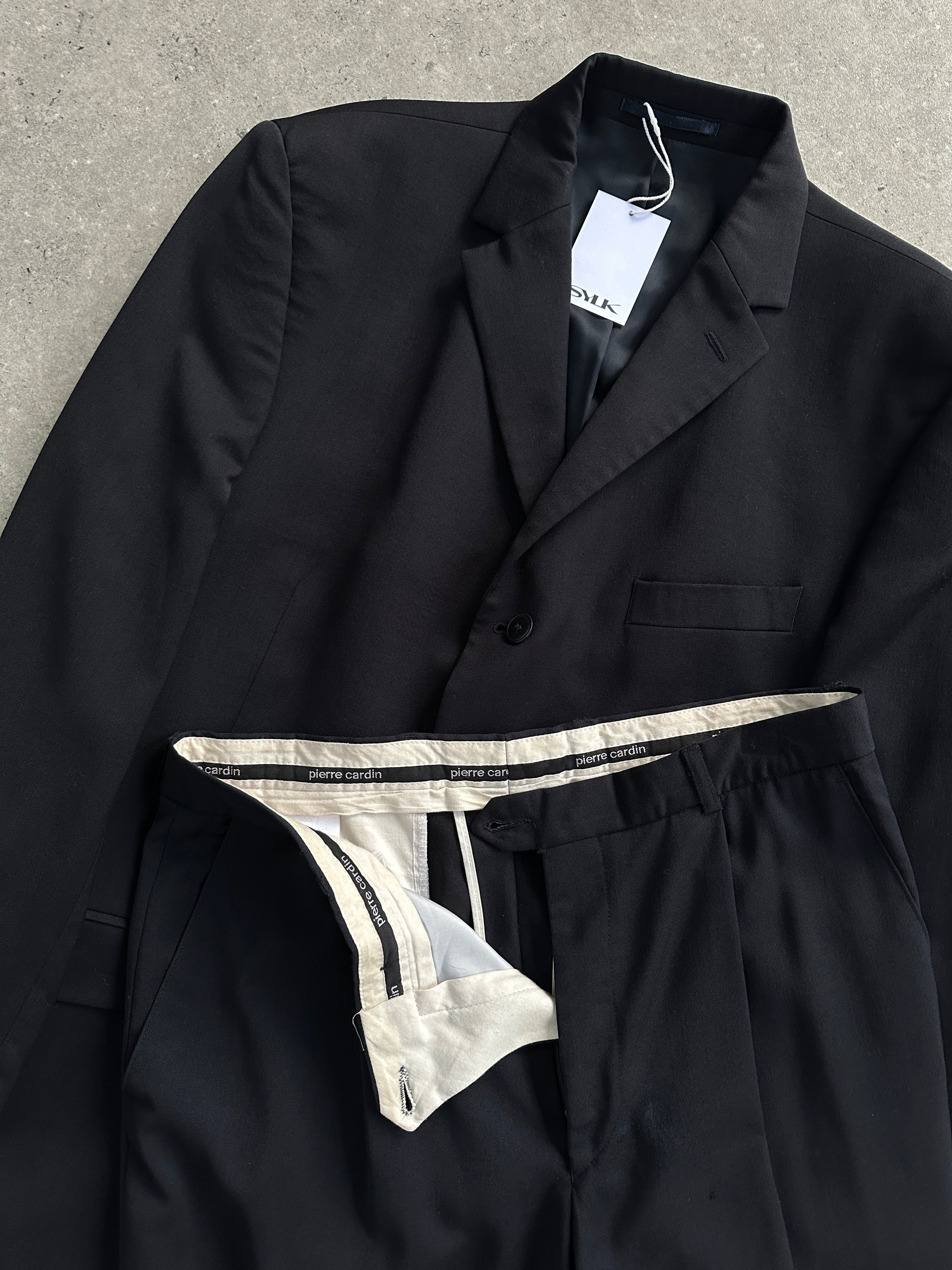 Pierre Cardin pure wool single-breasted jumpsuit in size 44S/W32, tailored with lapels and button closure, black color.