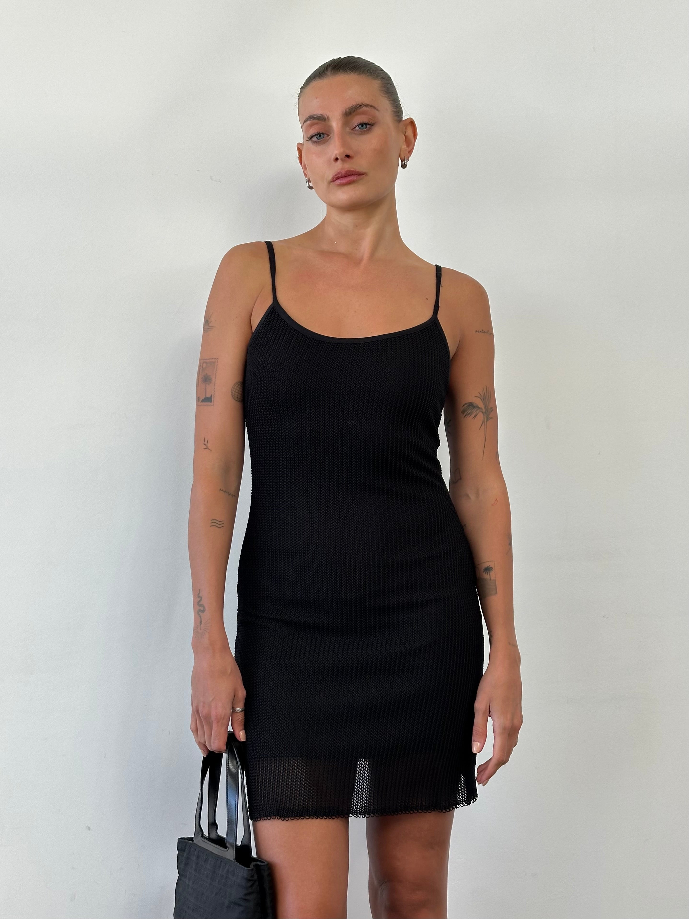Vintage French vintage double-layered mini slip dress in size small, featuring delicate lace and lightweight fabric.
