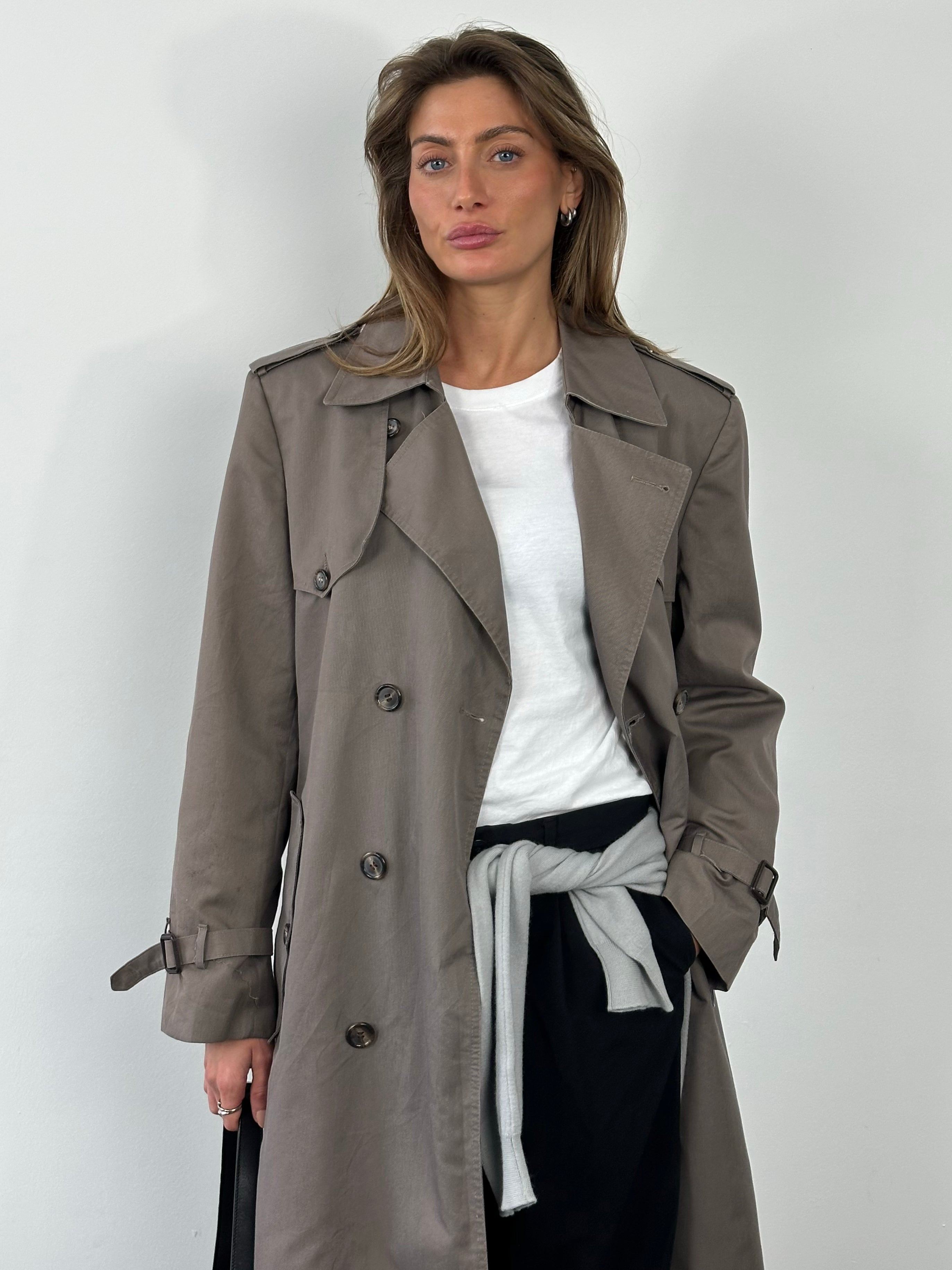 Christian Dior Monsieur 1980s double-breasted belted trench coat, beige fabric with wide lapels and classic belt details.