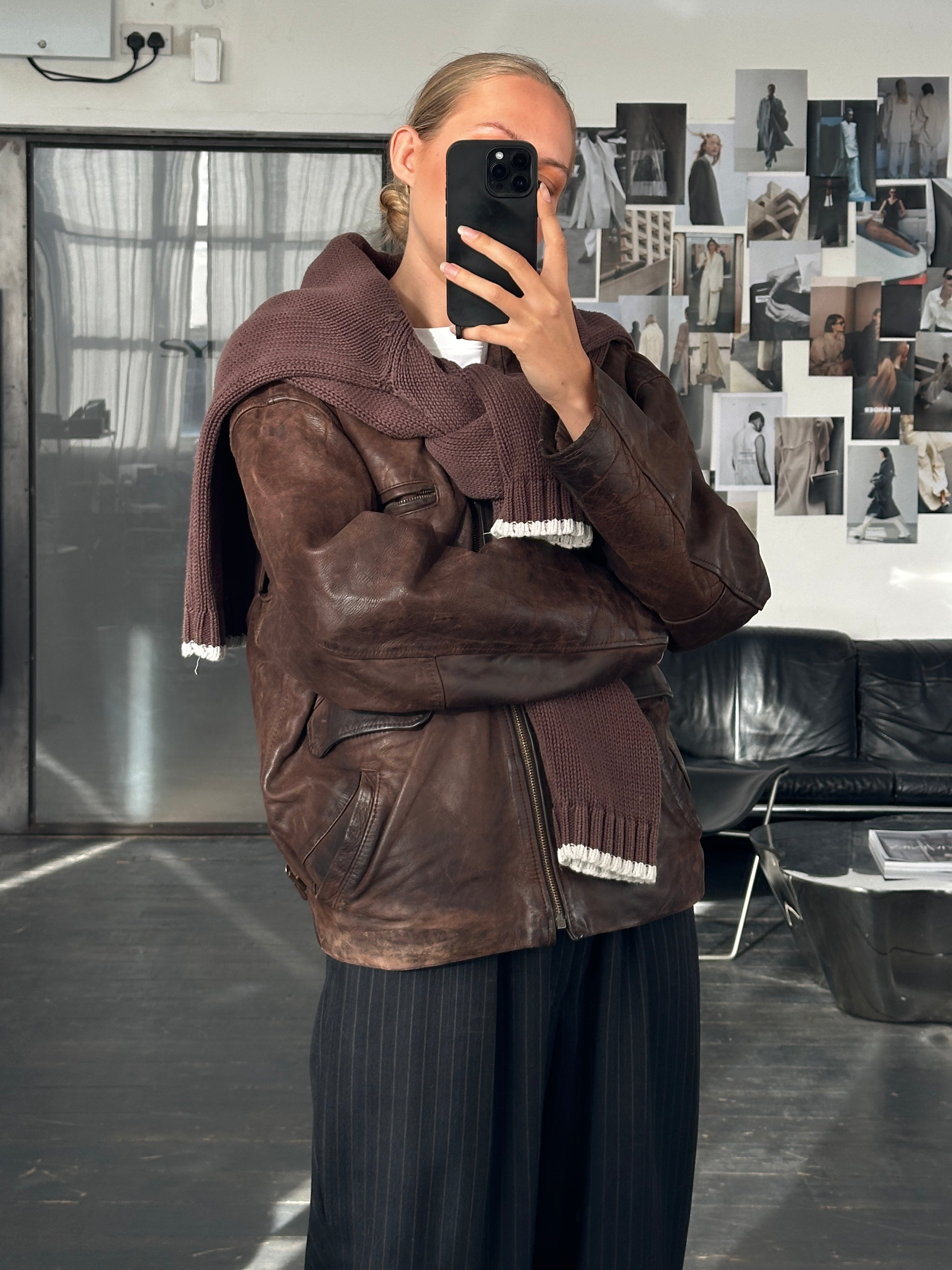 Vintage French 1980s boxy leather jacket, aged brown leather, vintage style, front view with collar and button details.