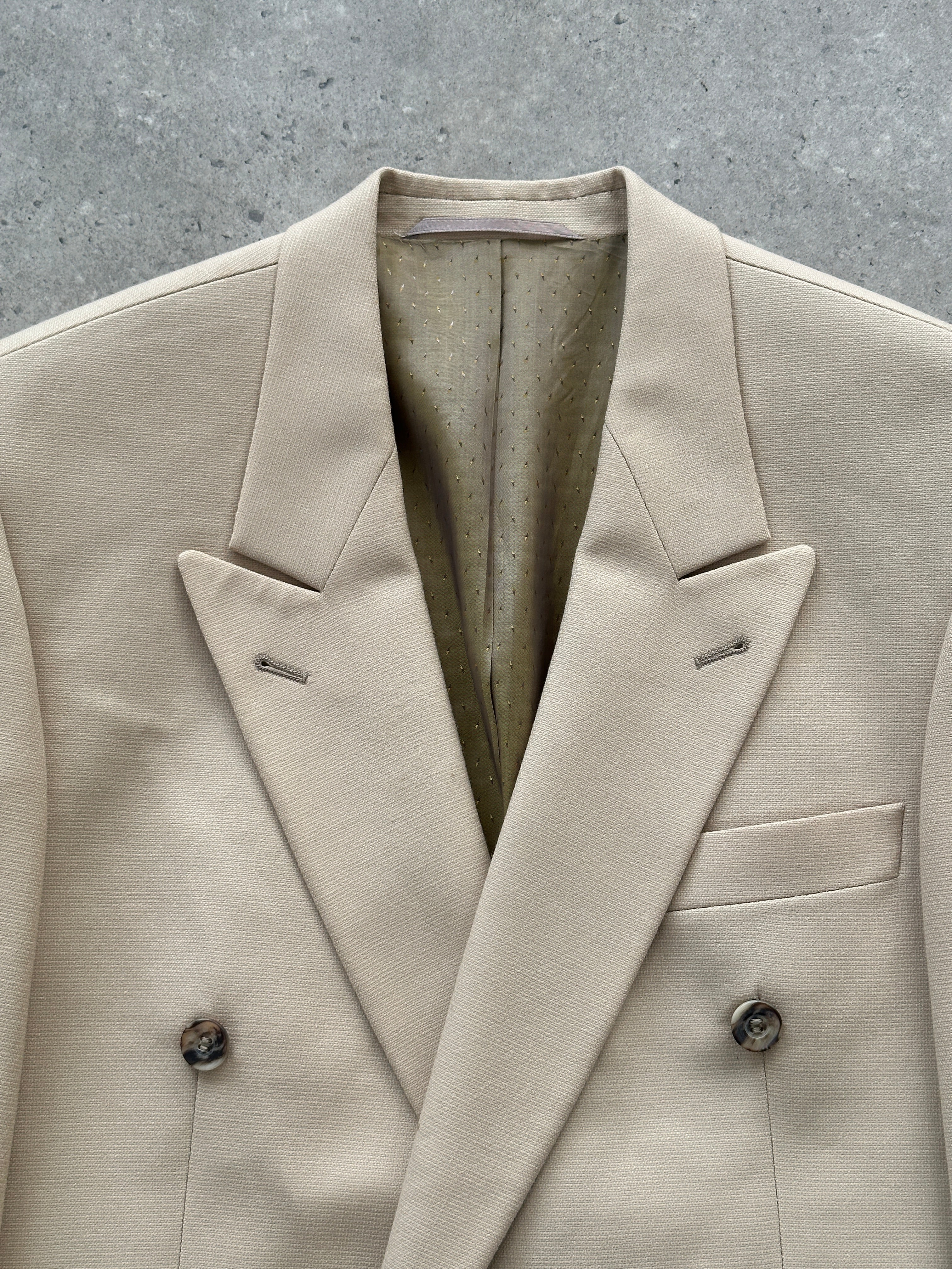 Vintage wool double-breasted blazer in size 40R/L, shown on a hanger with classic tailored fit and timeless style.