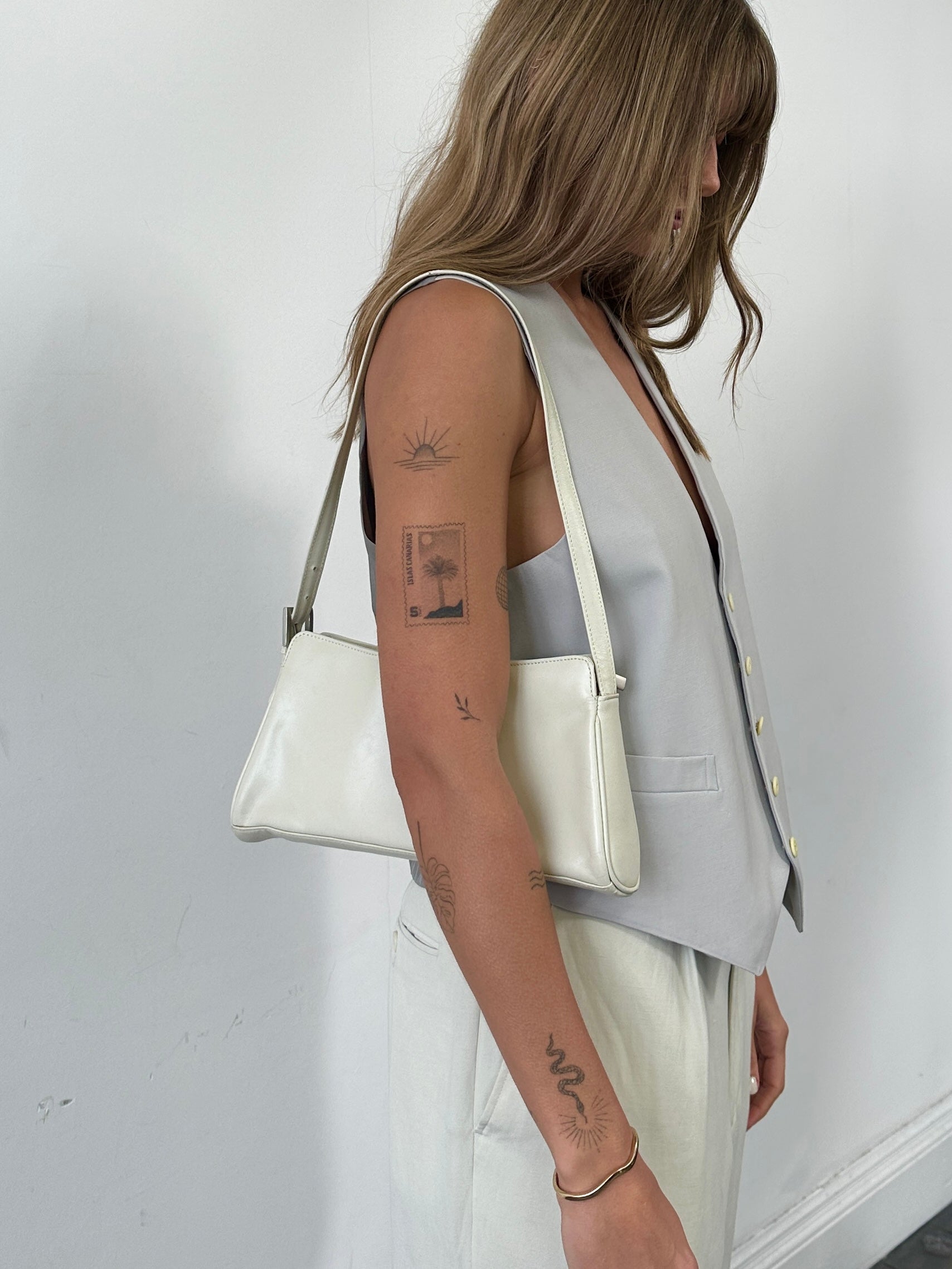 Vintage faux leather A-line shoulder bag with adjustable strap and classic design, perfect for casual and stylish outings.